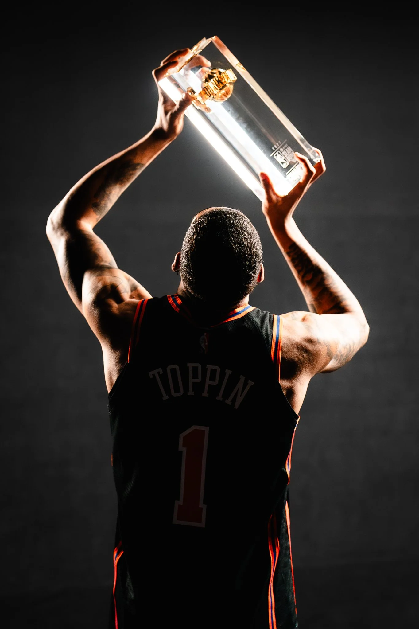 Obi Toppin of New York Knicks holds trophy after winning Slam Dunk Contest at 2022 NBA All-Star Weekend.