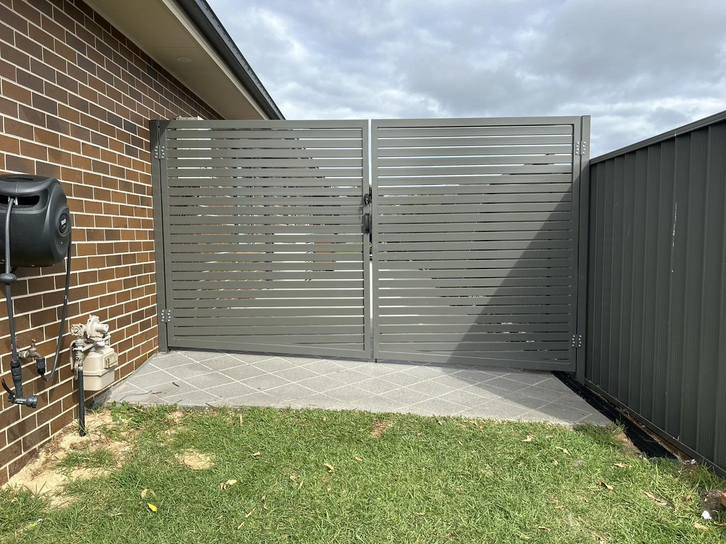 Replaced some colour bond double gates today with some custom Raked Privacy Slat gates for a lovely family to update the side area and make it more functional for caravan access and to keep the doggos in. All fitted with none other than a D &amp; D T