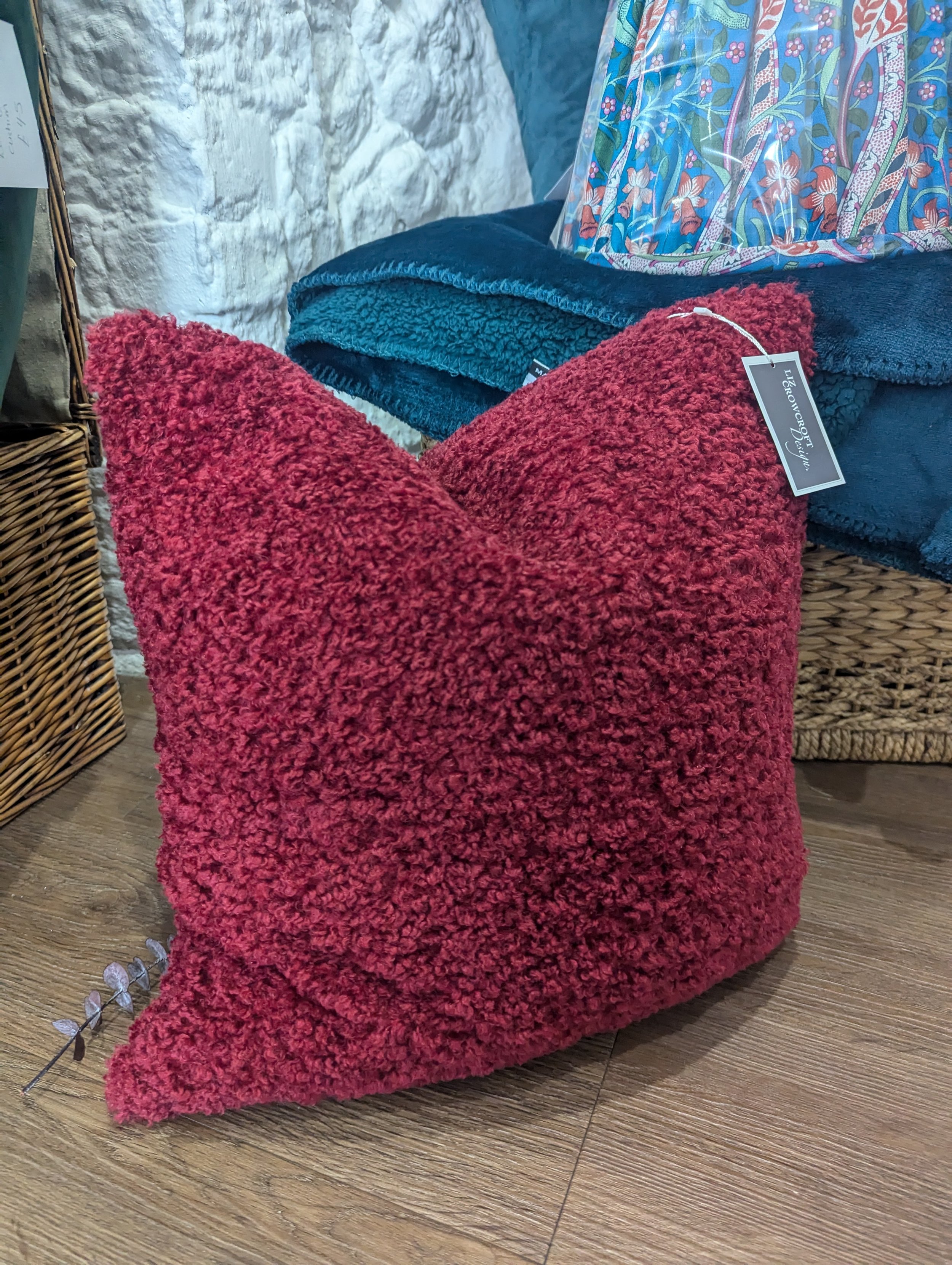 Soft, textured cushion in wine