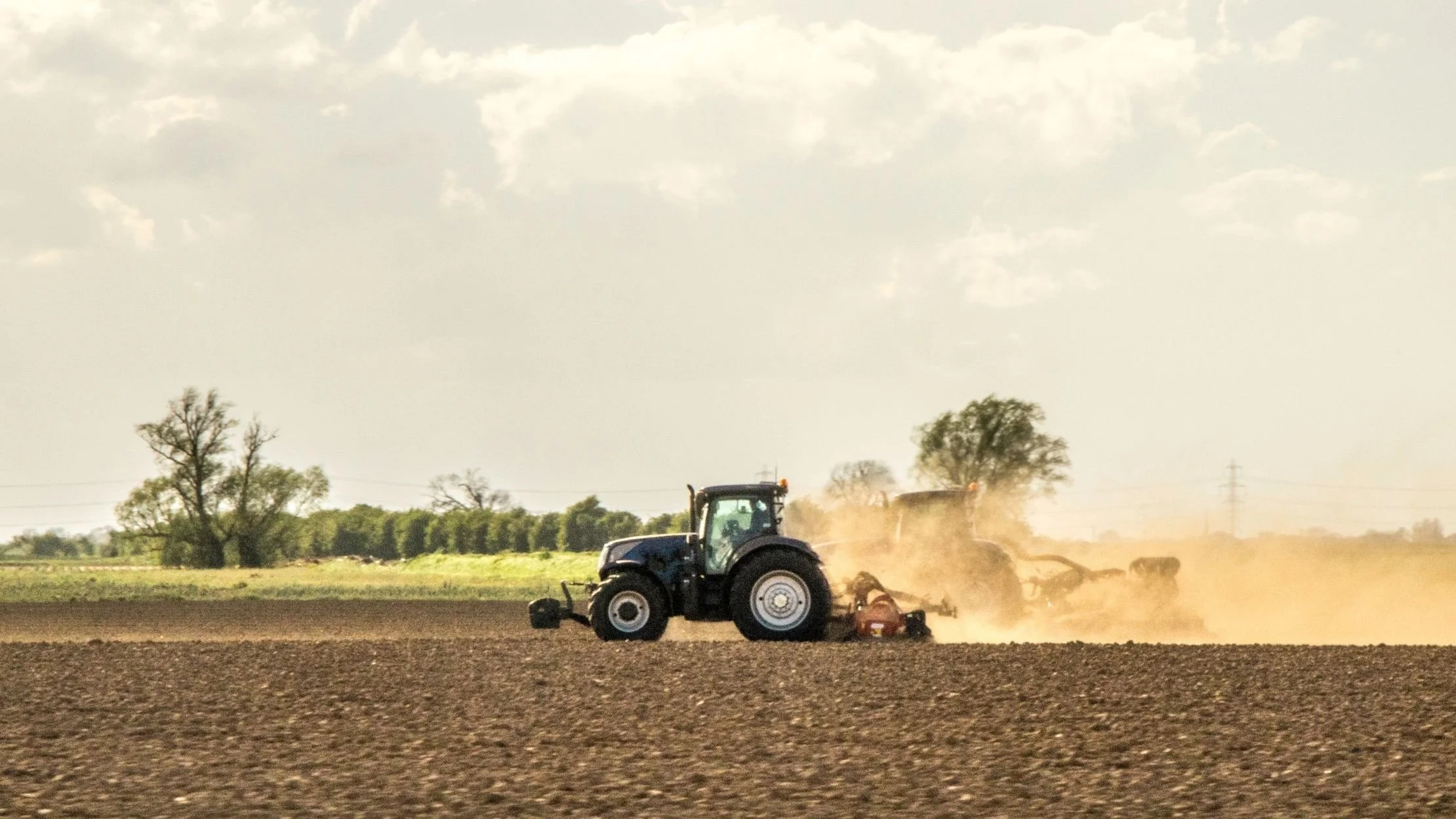 farm field, tractors, dust
