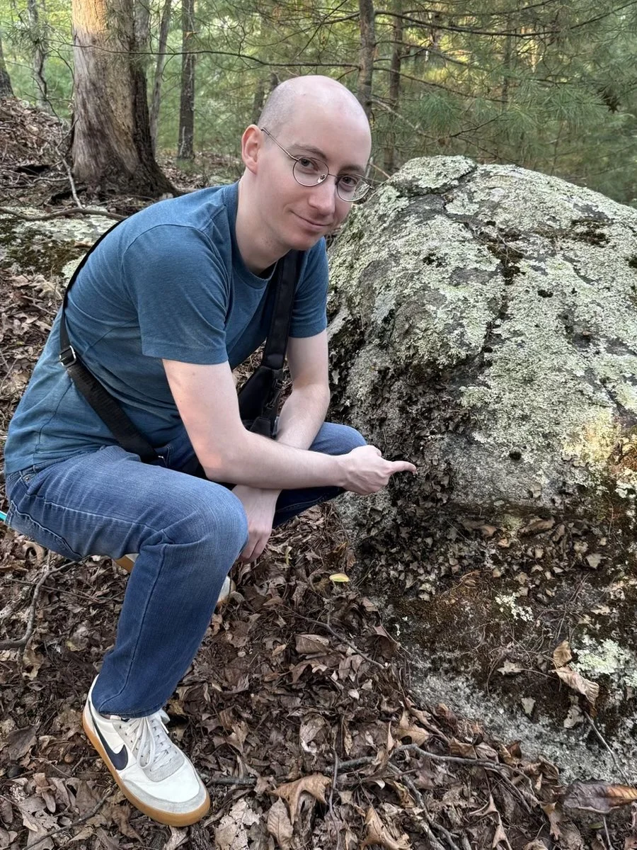 Photo: Patrick Hurd points to Umbilicaria mammulata growing on rock.
