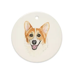 Round glossy ceramic ornament printed with a watercolor portrait of Rally the corgi