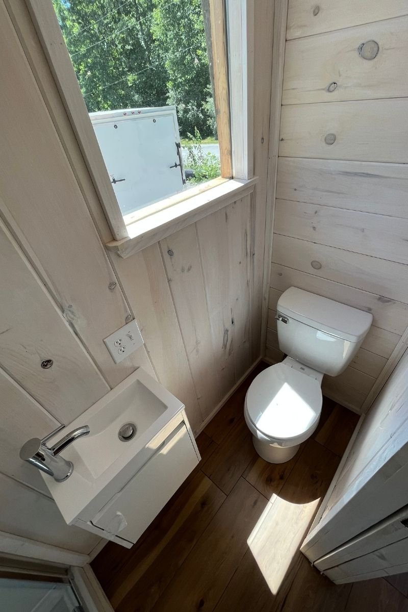 Bathroom of a Tiny Home with small sink and toilet
