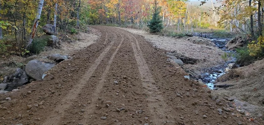 Roadway Resurfaced; Disturbed Soil Seeded & Hayed