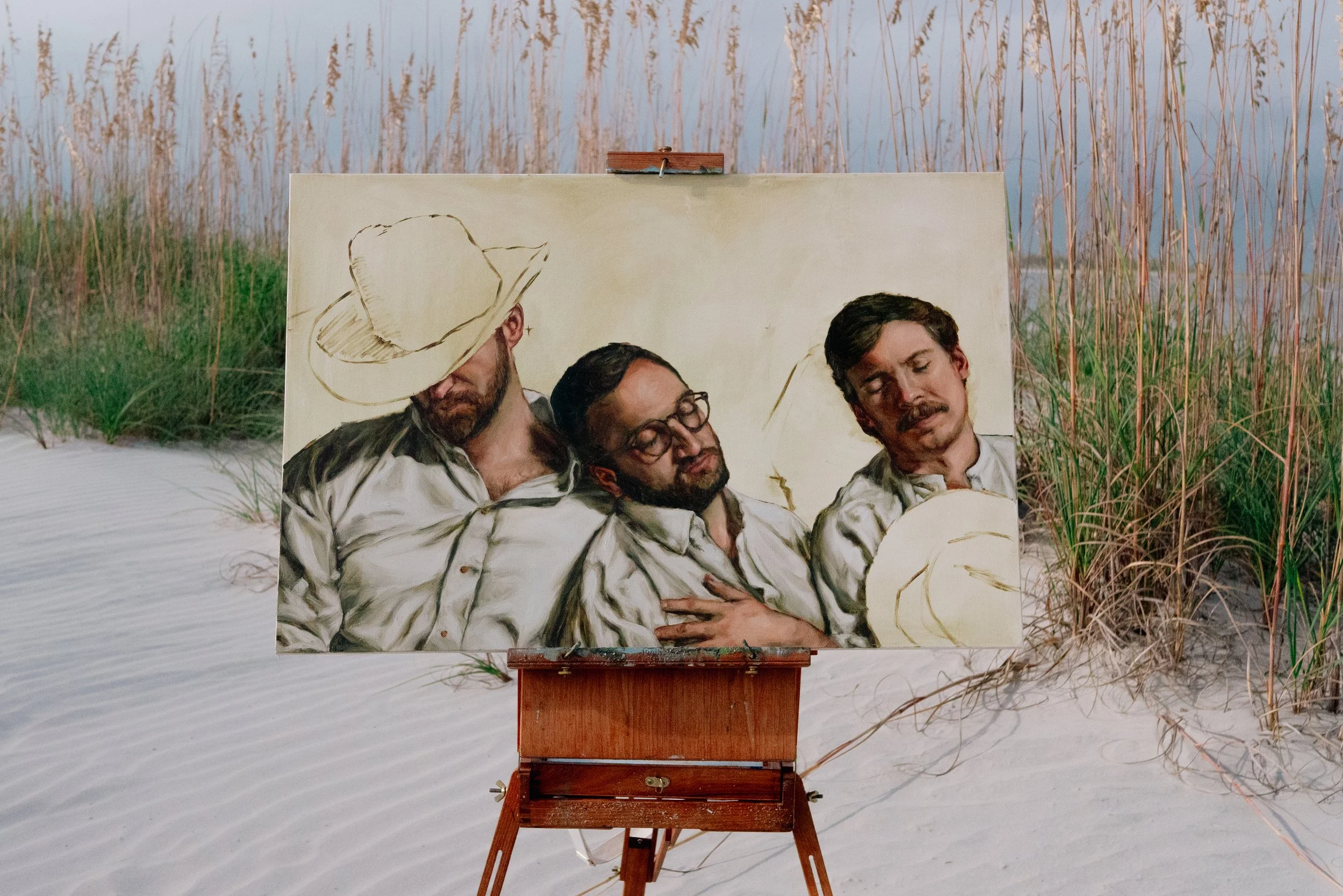 Close view of figurative oil painting against Tybee Island coastal landscape