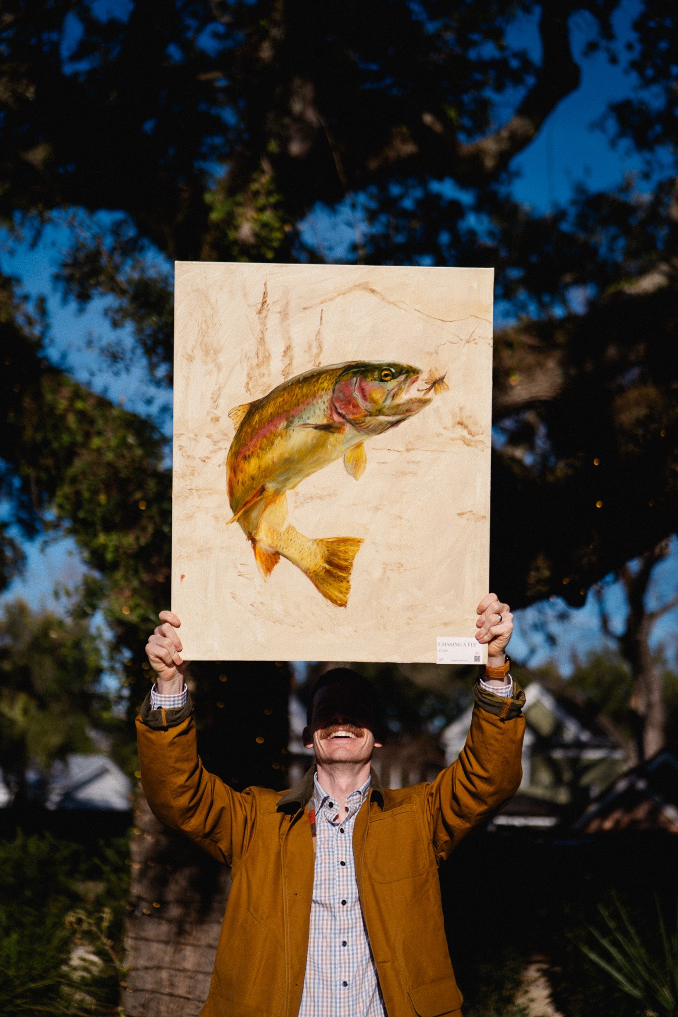 Oil painting of a rainbow trout titled Chasing a Fly by Hampton Watts — live painting at SEWE with Garden and Gun Charleston
