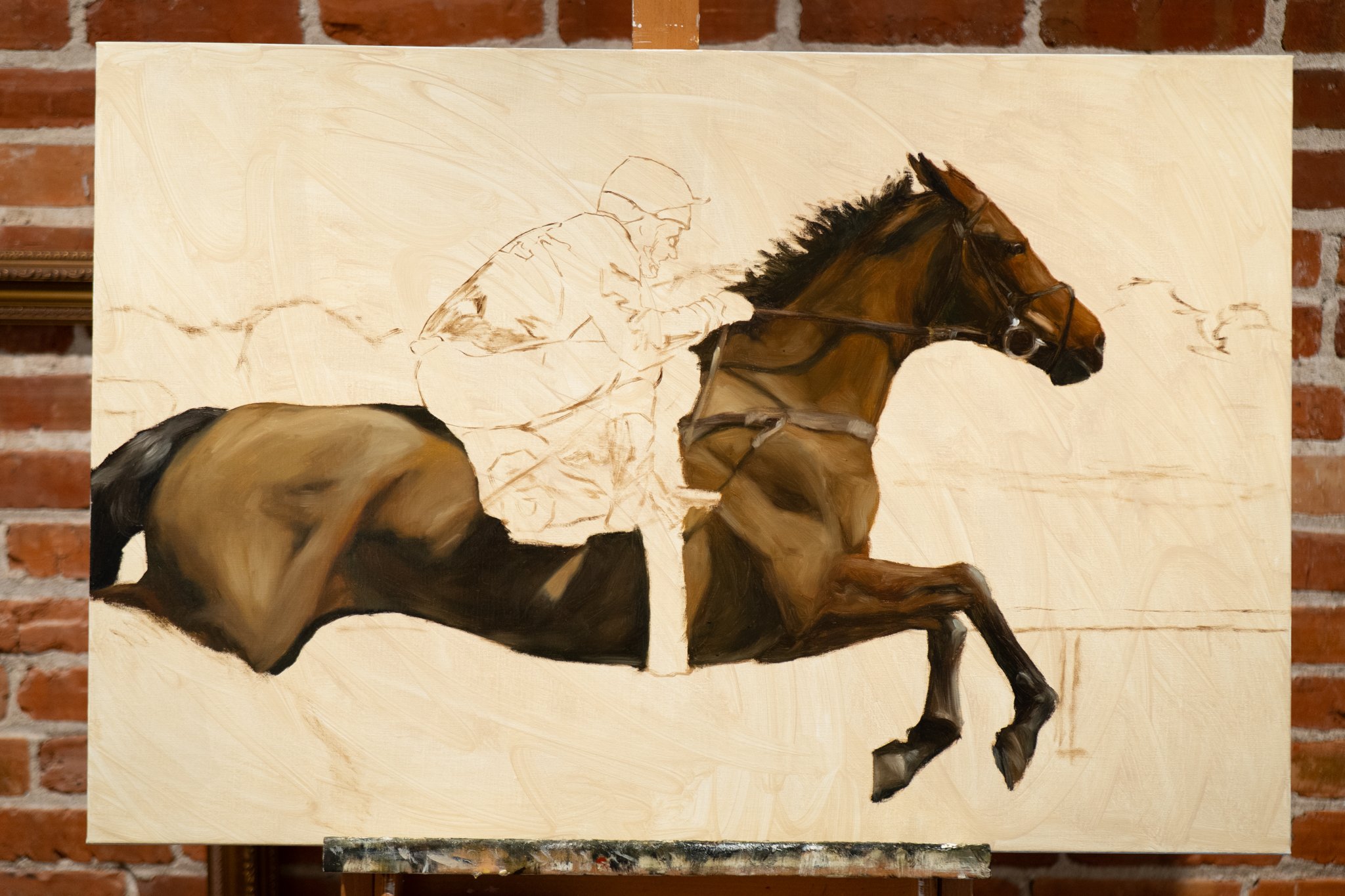 Early underpainting stage of Aiken in April, equestrian oil painting in progress by Hampton Watts, chestnut horse and jockey taking shape on canvas