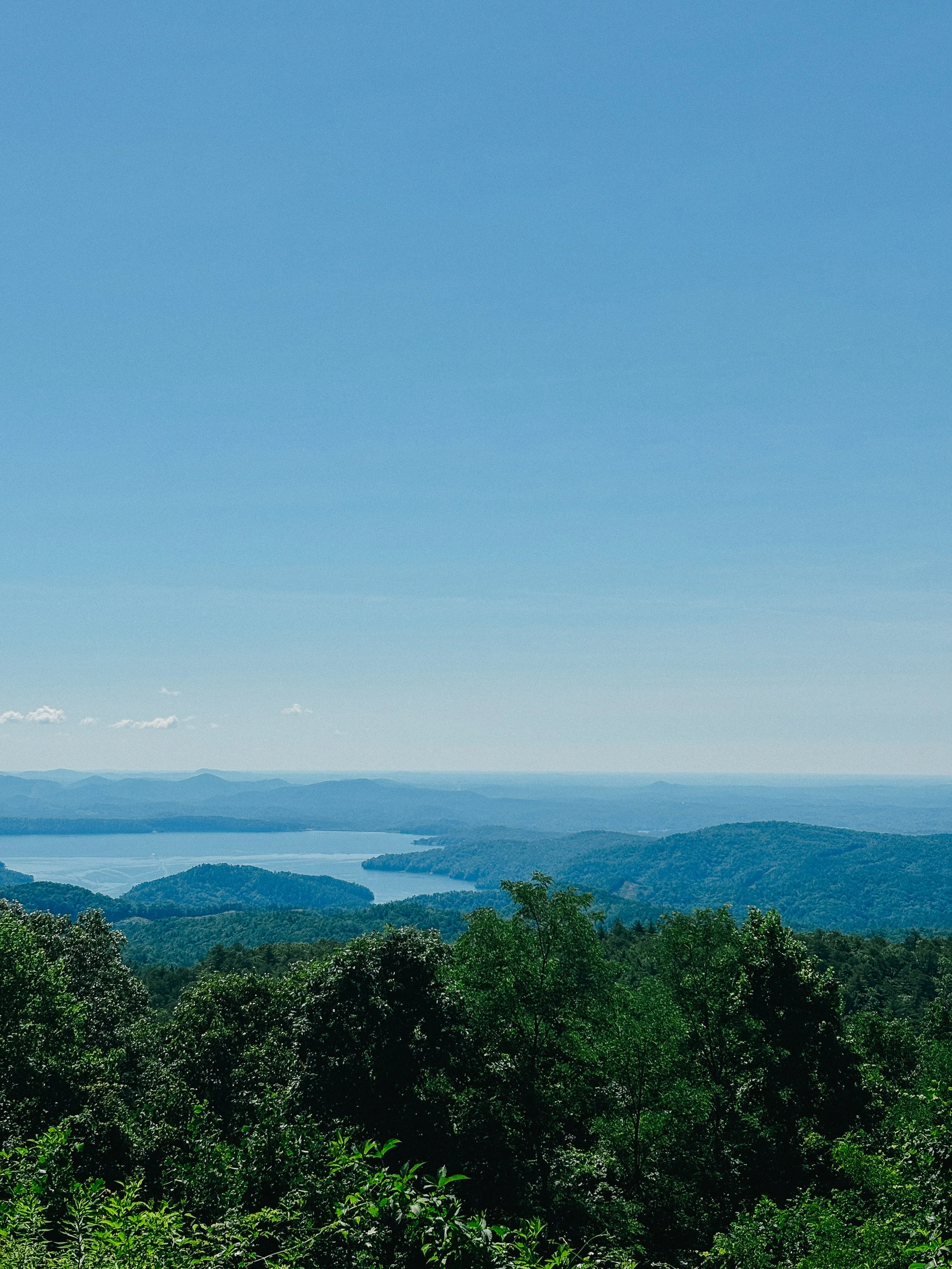 View of forested Blue Ridge mountain ridges and a river valley in western North Carolina, on the drive up to Cashiers
