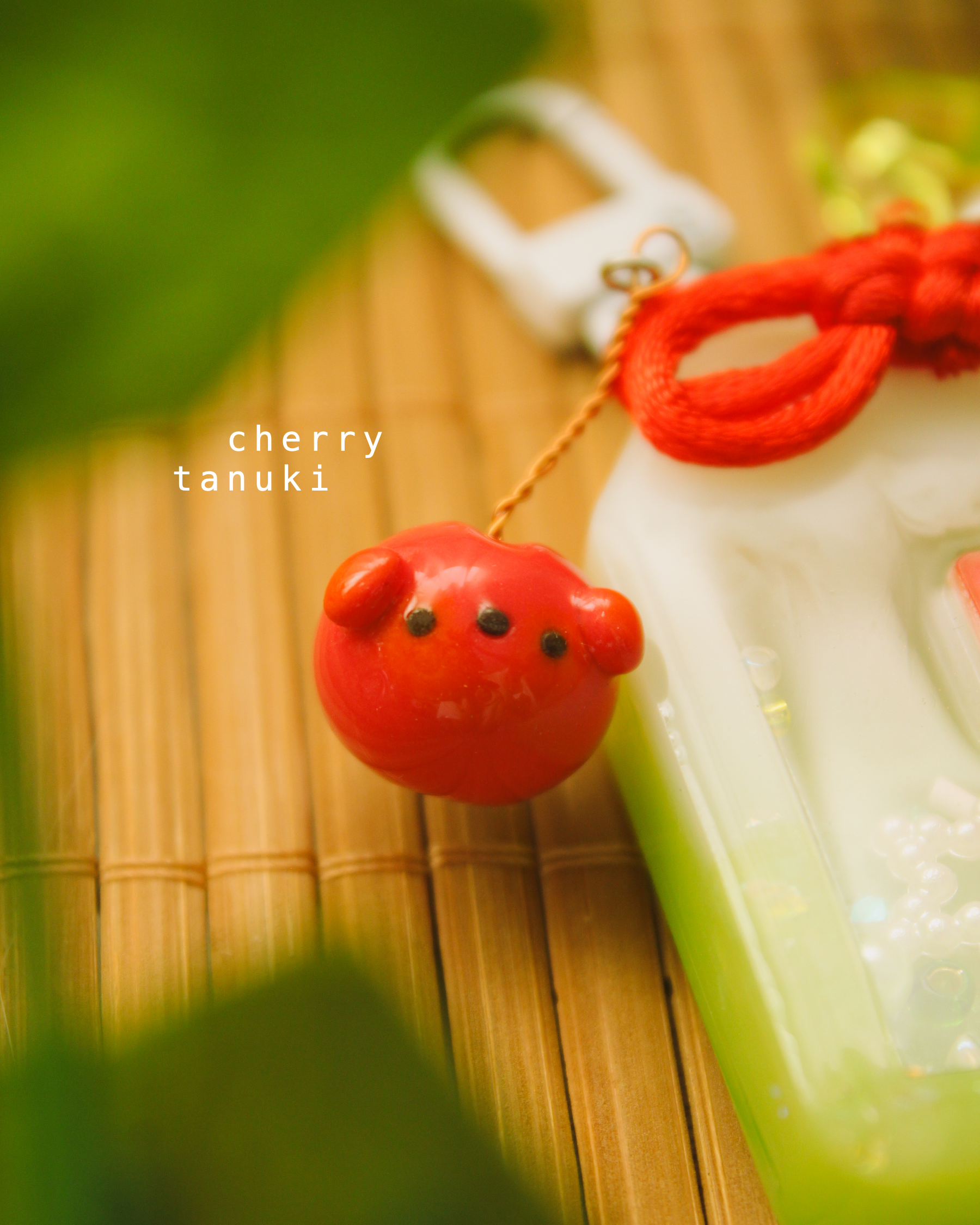 melon soda omamori - tanuki.png