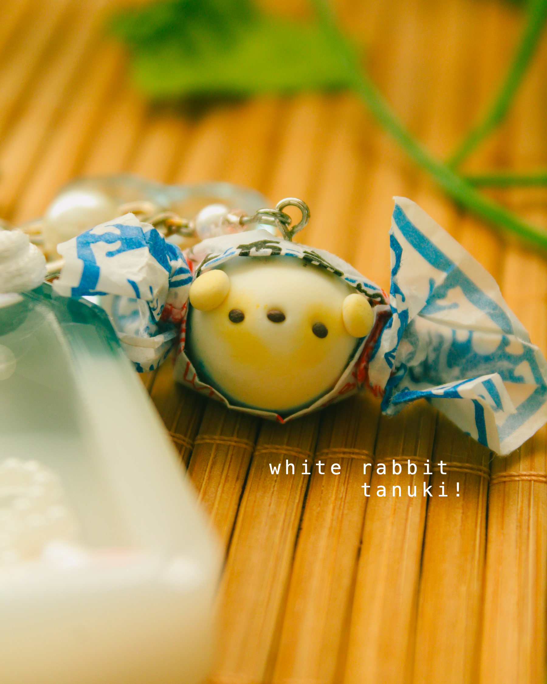 white rabbit omamori - tanuki.png