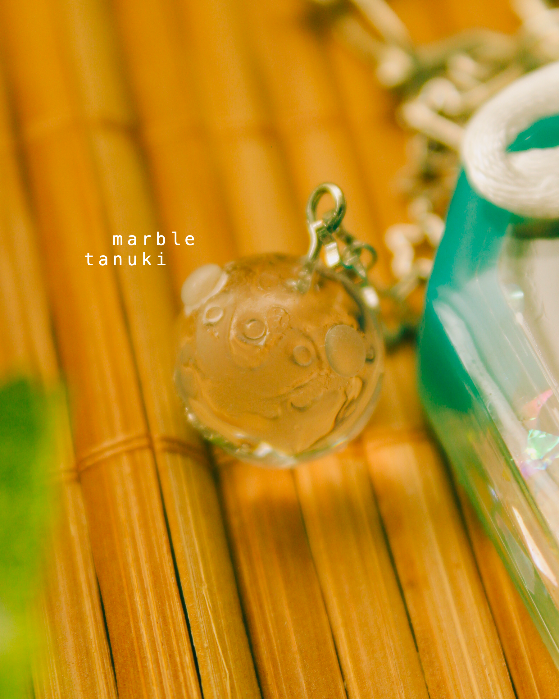 ramune omamori - tanuki.png