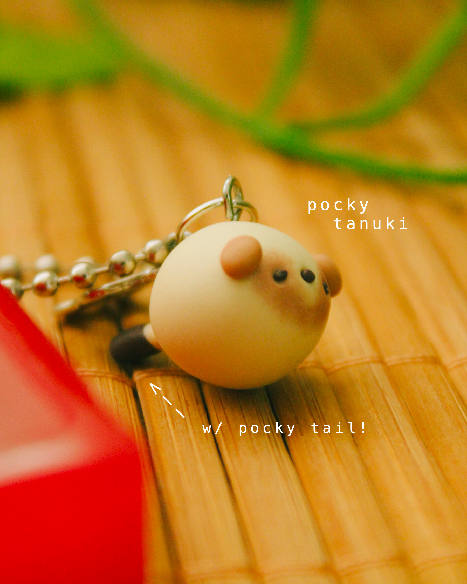 pocky omamori - tanuki.png
