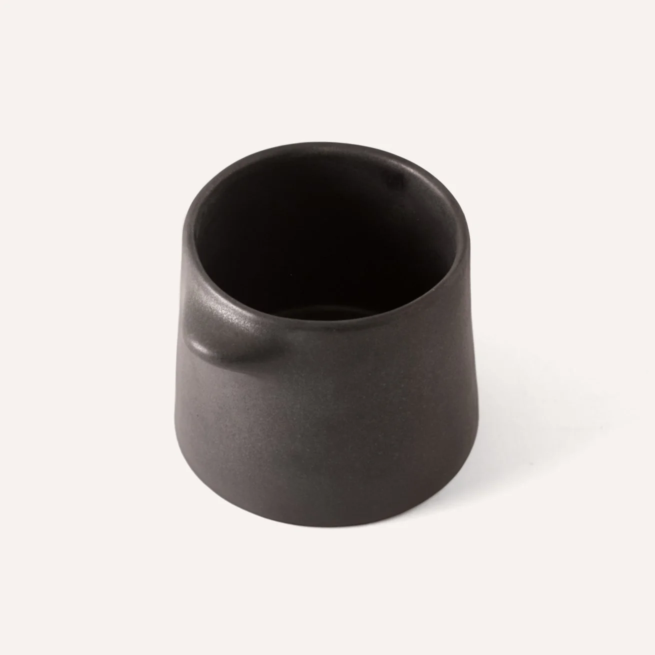 matt-black-stoneware-handleless-cup.jpg