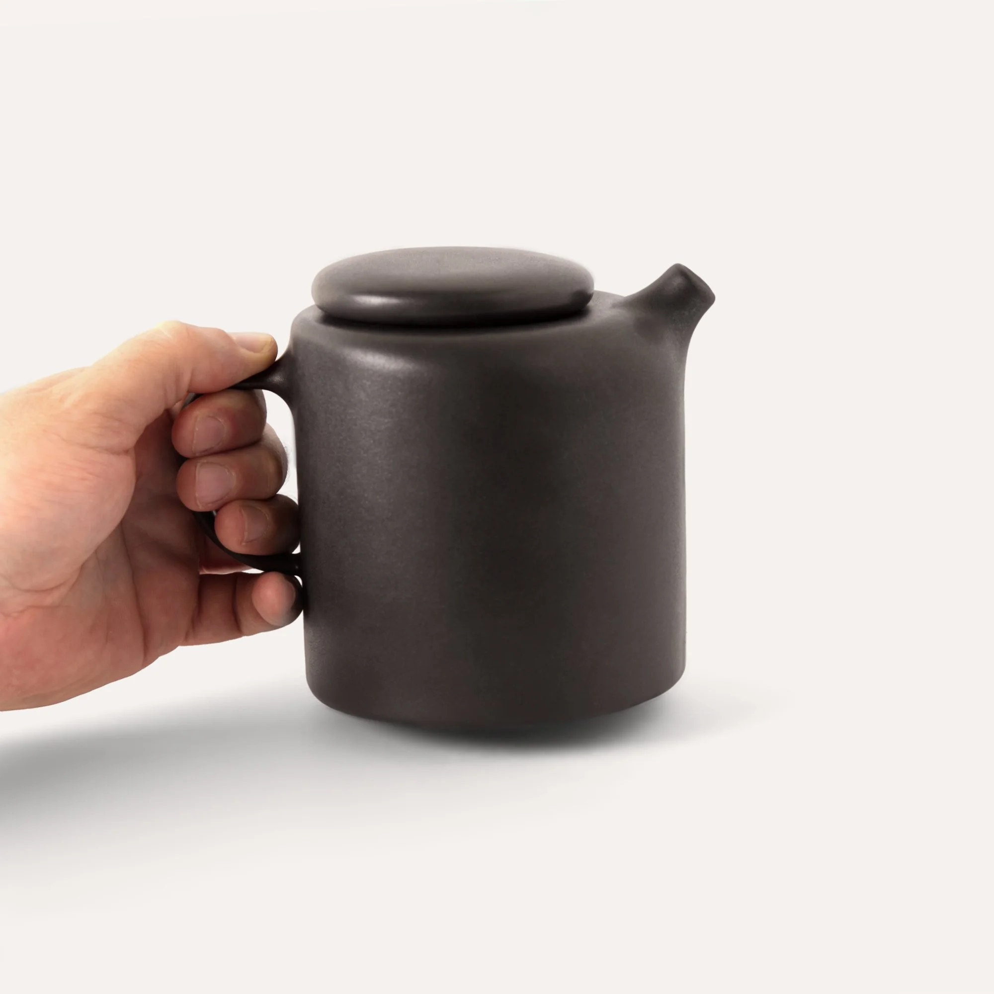 unique-tea-pot-in-hand.jpg