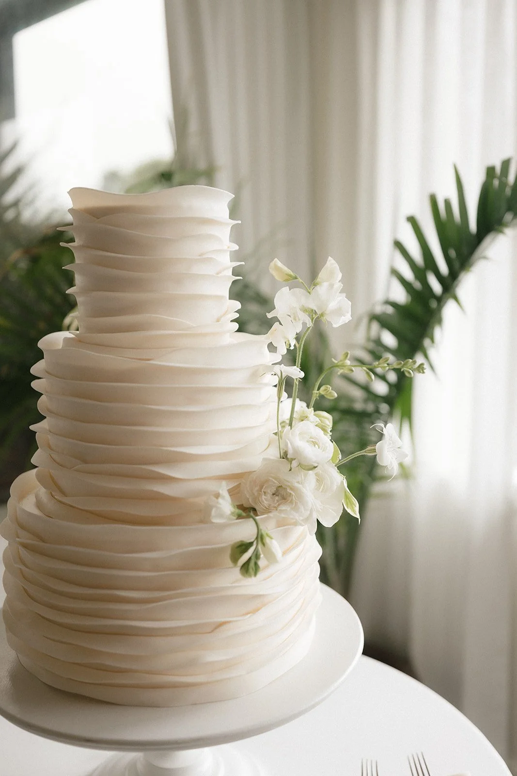 wedding cake with white flowers