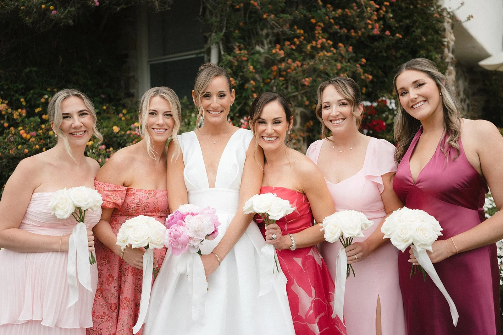 bride and bridesmaids with bouquets