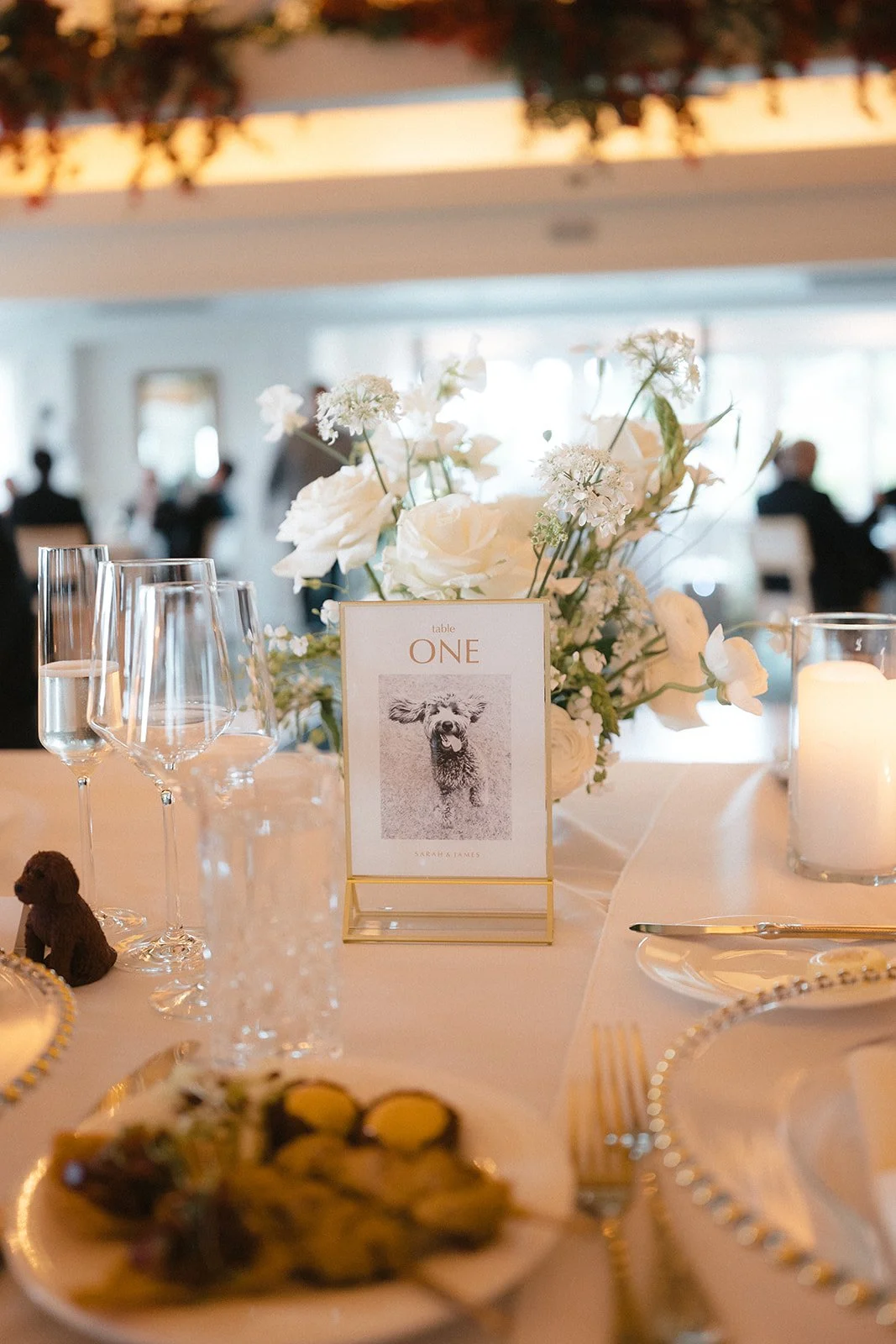 centerpiece with white flowers and table number