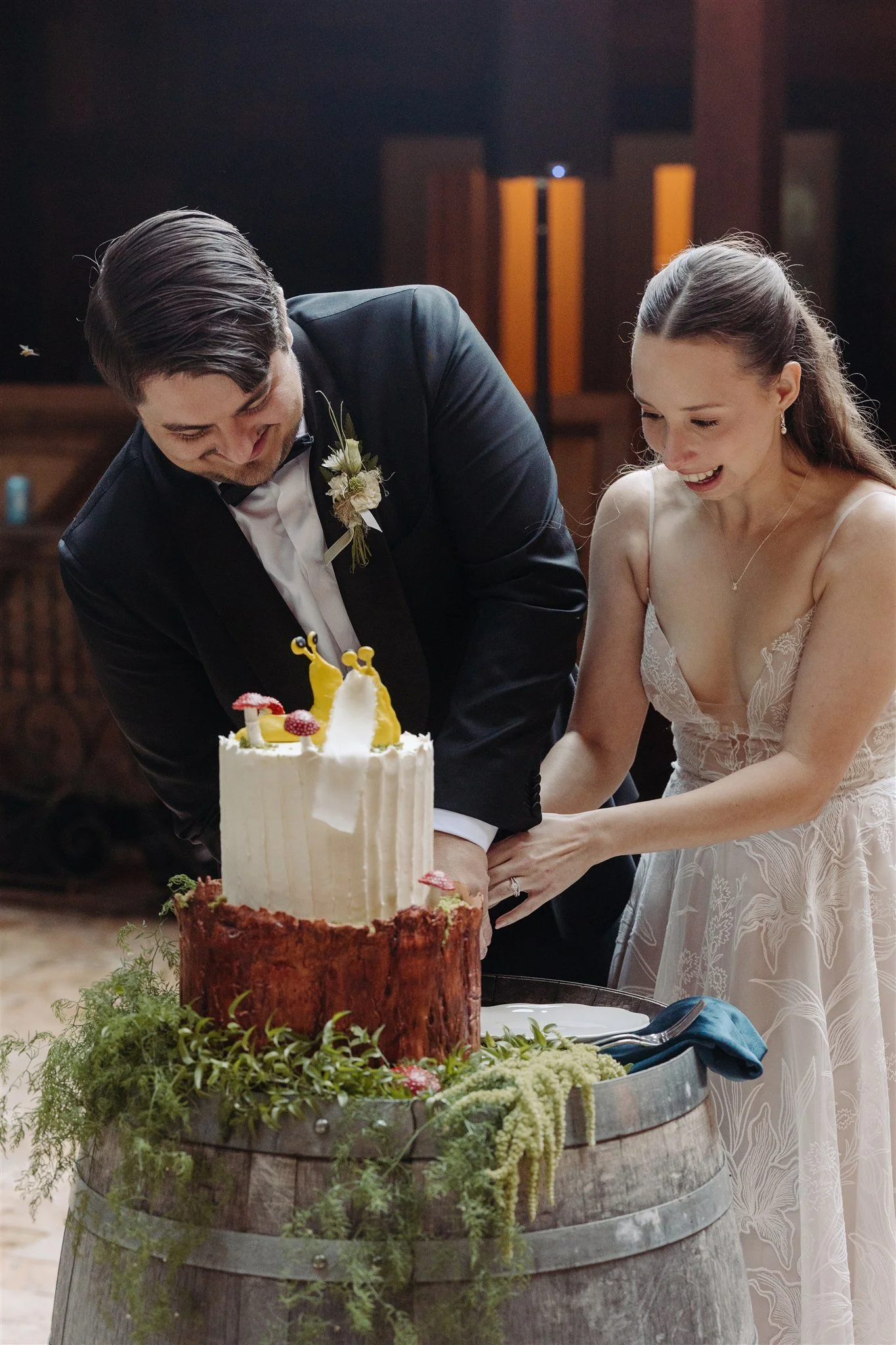 couple cutting banana slug wedding cake