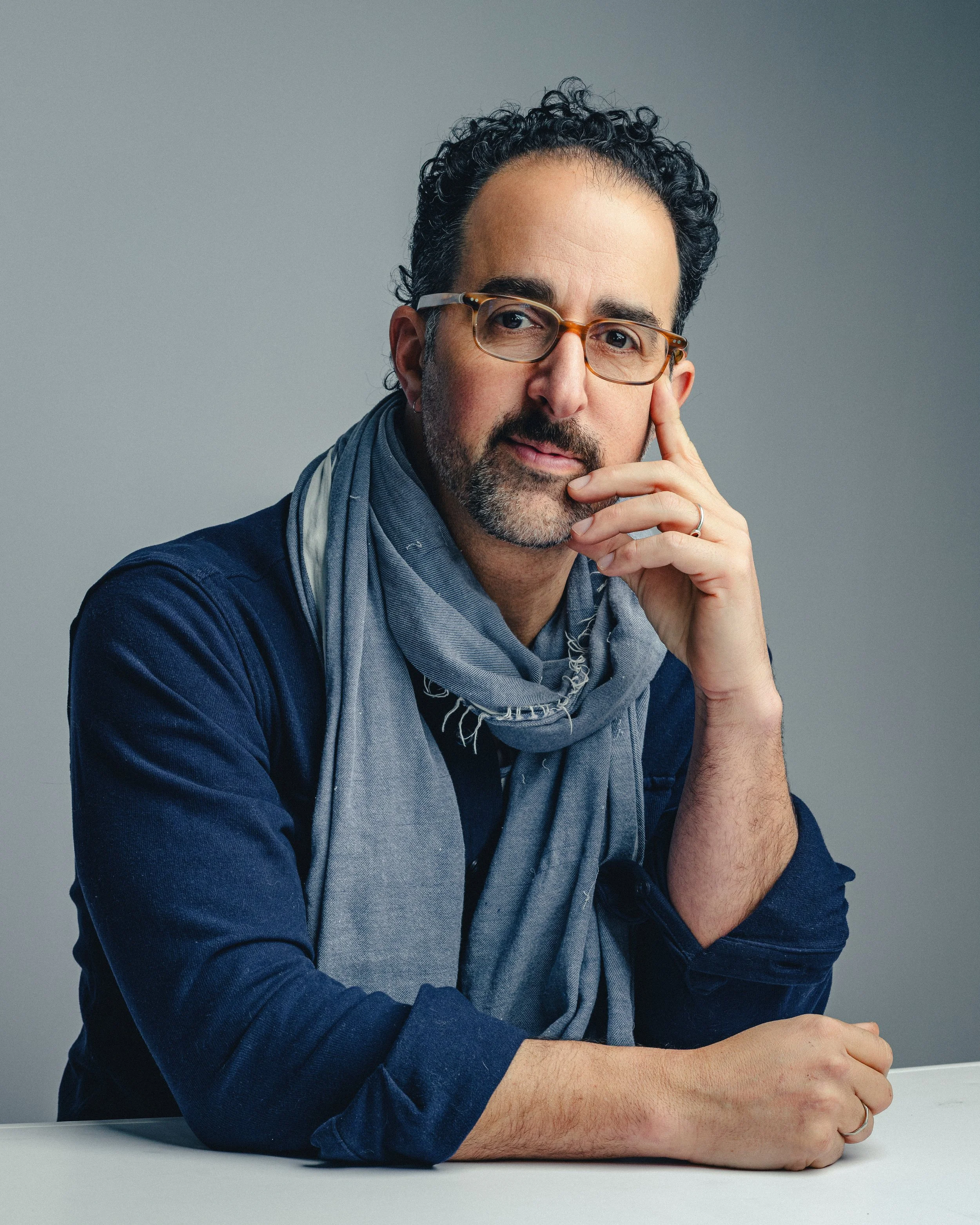 Portrait of a Connecticut landscape photographer on a grey background