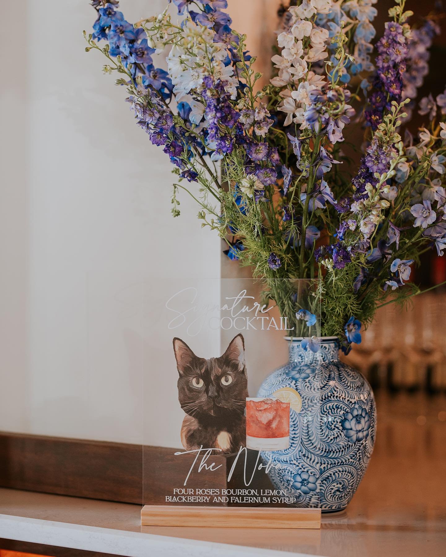 Not sure what we love more in this photo&ndash; the blue and white urn, the tall delphinium, or that Nova, our couple&rsquo;s cat is on the bar menu!

Photo: @edeninglephoto 
Venue: @thesaintelle 
Florals: @sunburstflorals 
Planning: @wevents 
&bull;
