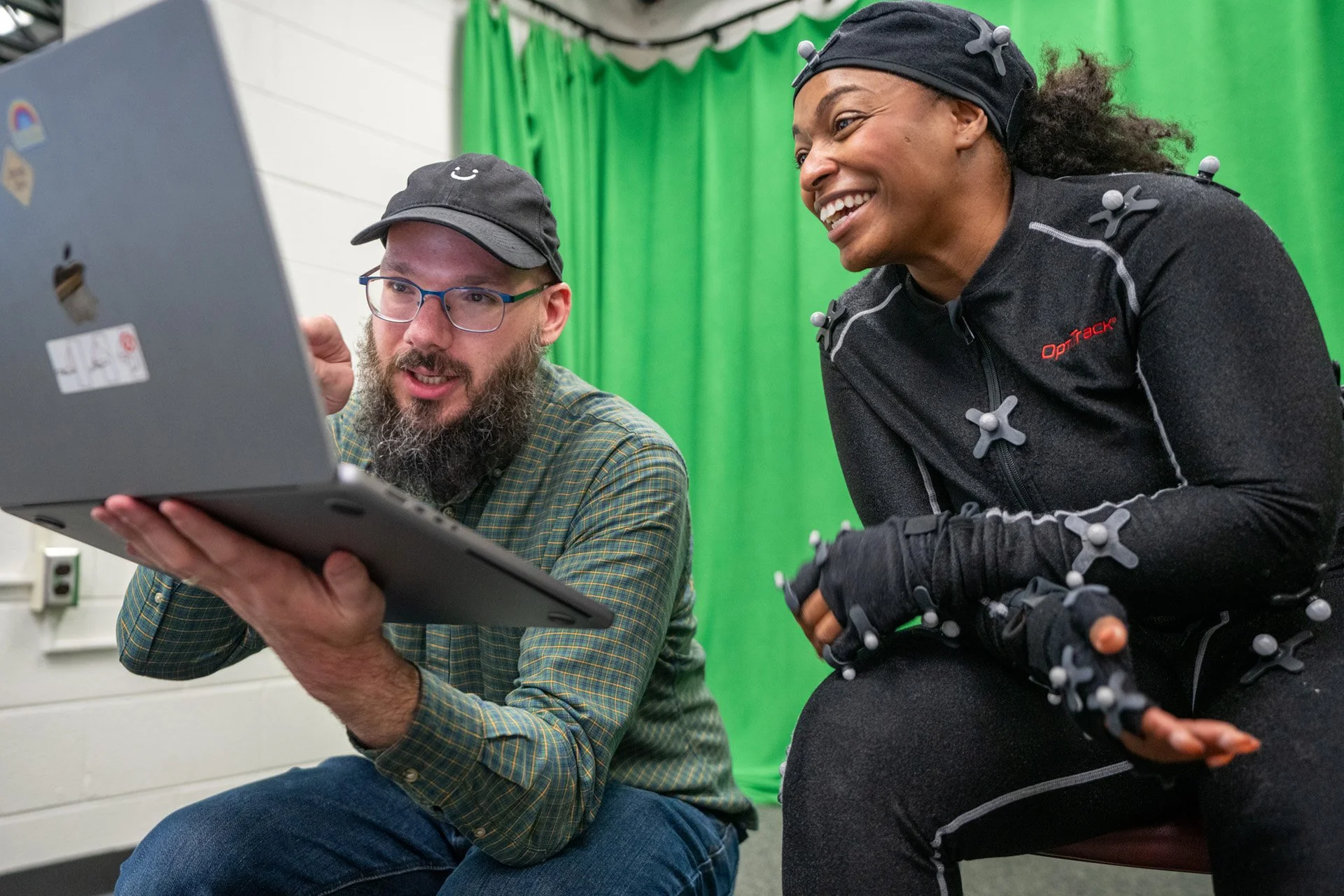 Trevor Finney and Brittney Harris reviewing animation in the motion capture room. Photo by Clark Dehart for Virginia Tech.