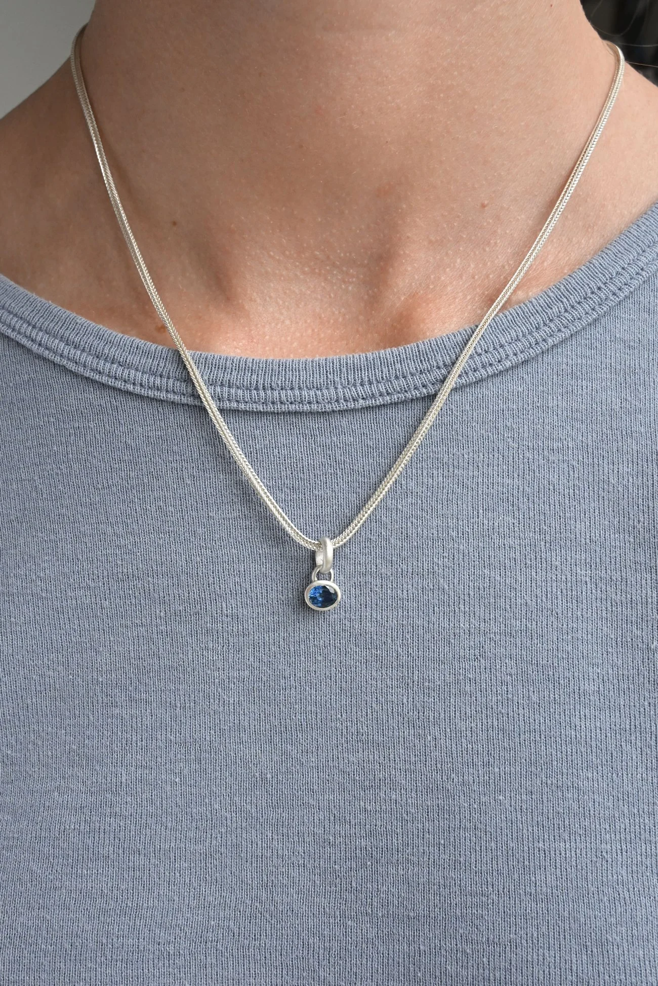 Dunton-Ellerkamp-Silver-Sapphire-Pendant-On-Figure-Blue.jpg