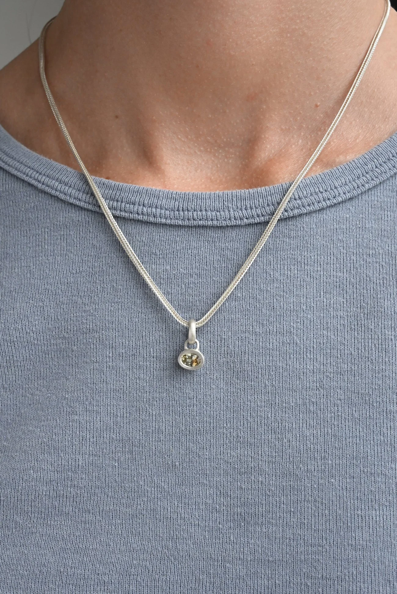 Dunton-Ellerkamp-Silver-Sapphire-Pendant-On-Figure-Yellow-Blonde.jpg
