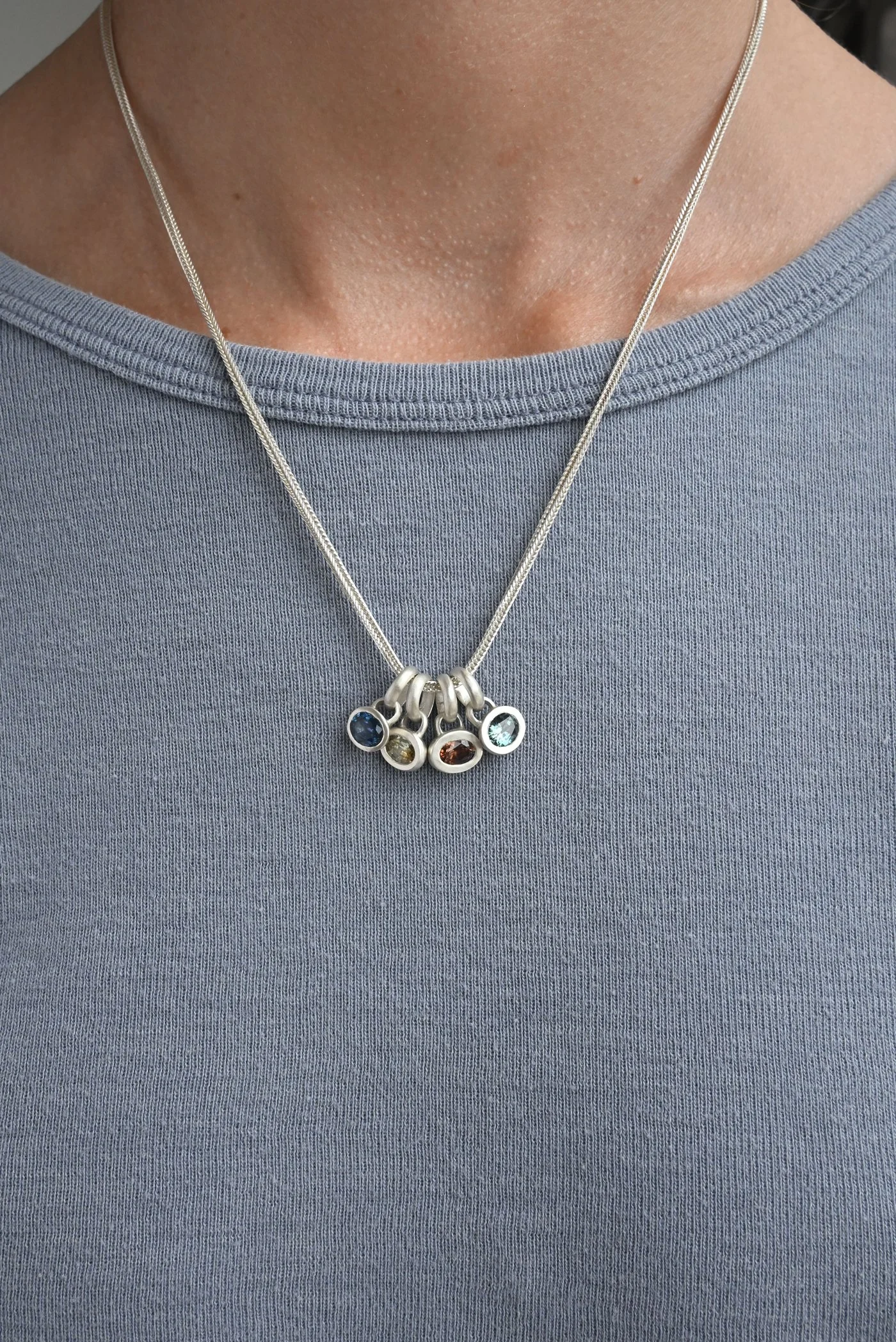 Dunton-Ellerkamp-Silver-Sapphire-Pendant-On-Figure-Group.jpg