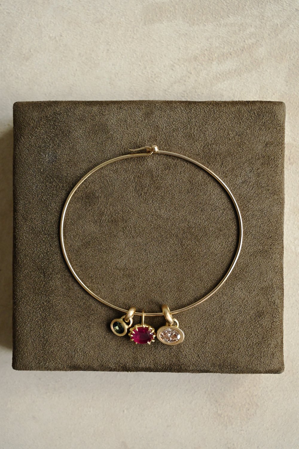 Dunton_Ellerkamp_Gold_Tension_Bangle_Diamond_Charms.jpg