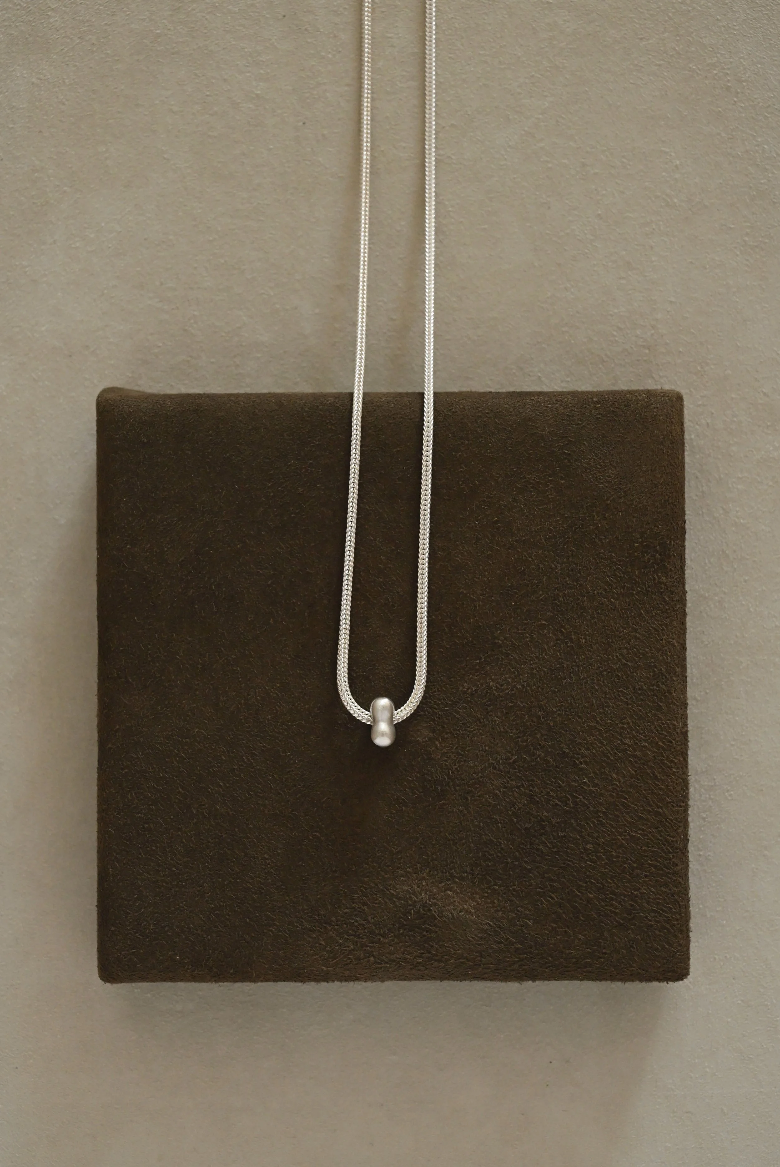 Dunton-Ellerkamp-Fall-Capsule-2026-Web-Silver-Owen-Spinner-Charm-1.jpg