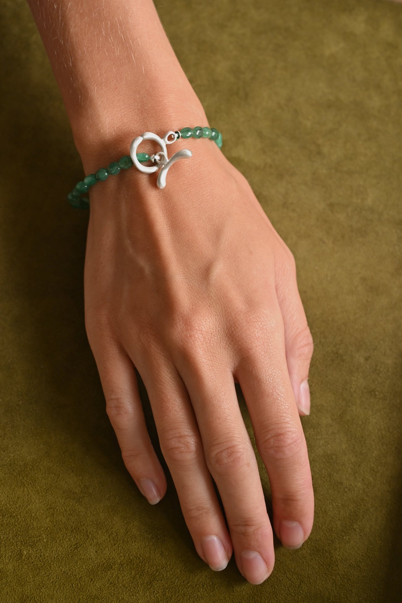 Dunton-Ellerkamp-Emerald-Silver-Bracelet--On-Figure-1.jpg