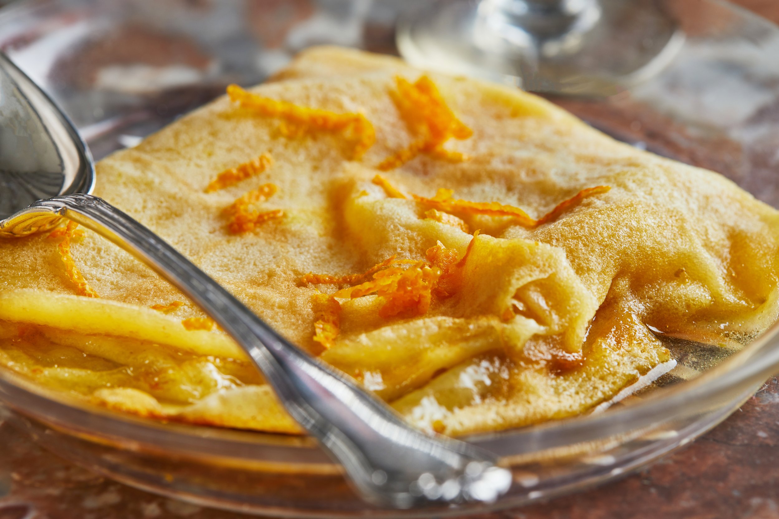 pancakes-with-crepe-suzette-in-transparent-plate-2021-12-09-06-54-47-utc.jpg