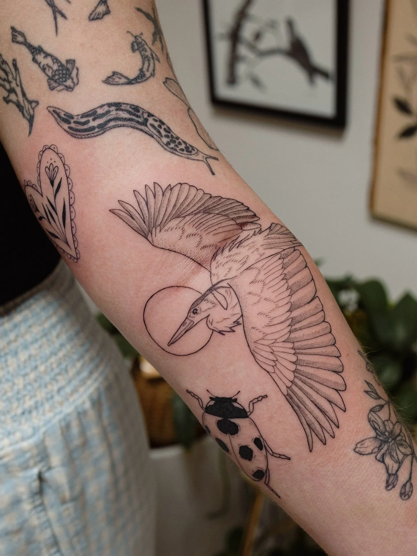 Nothing makes me happier than when flash pieces just fit so perfectly around existing tattoos! Lots of flash pieces were added to Jenna&rsquo;s patchwork sleeve today🪶&hearts;️🐞🌿 thanks my love for spending the day with me- Jenna&rsquo;s been gett