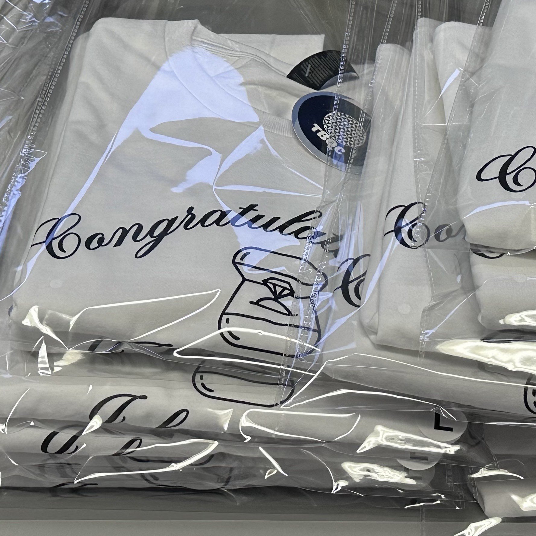 Screen printed "Congratulate me I became a bride to be" White cotton T-shirt with Black lettering"