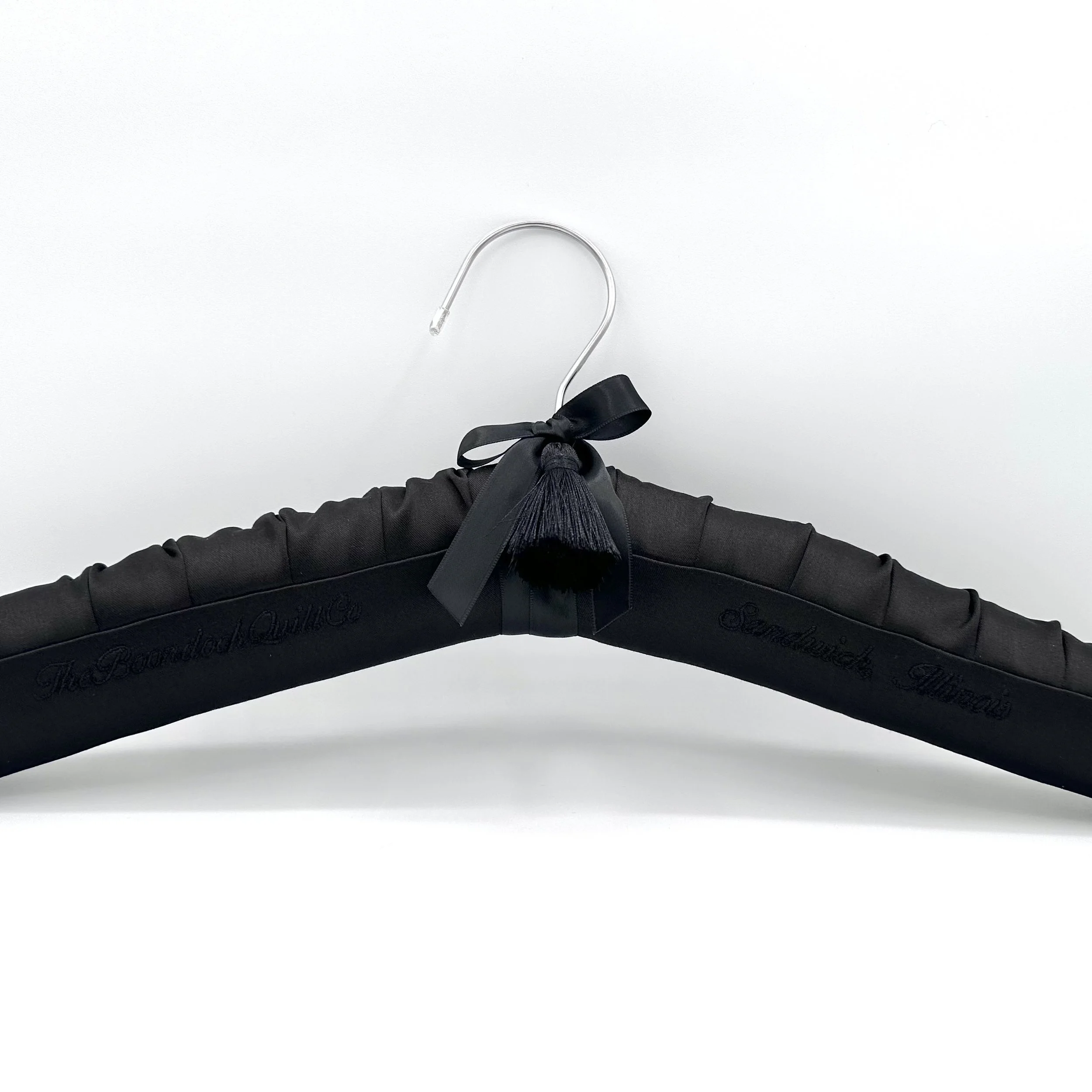Black satin bridal hanger personalized with embroidery.