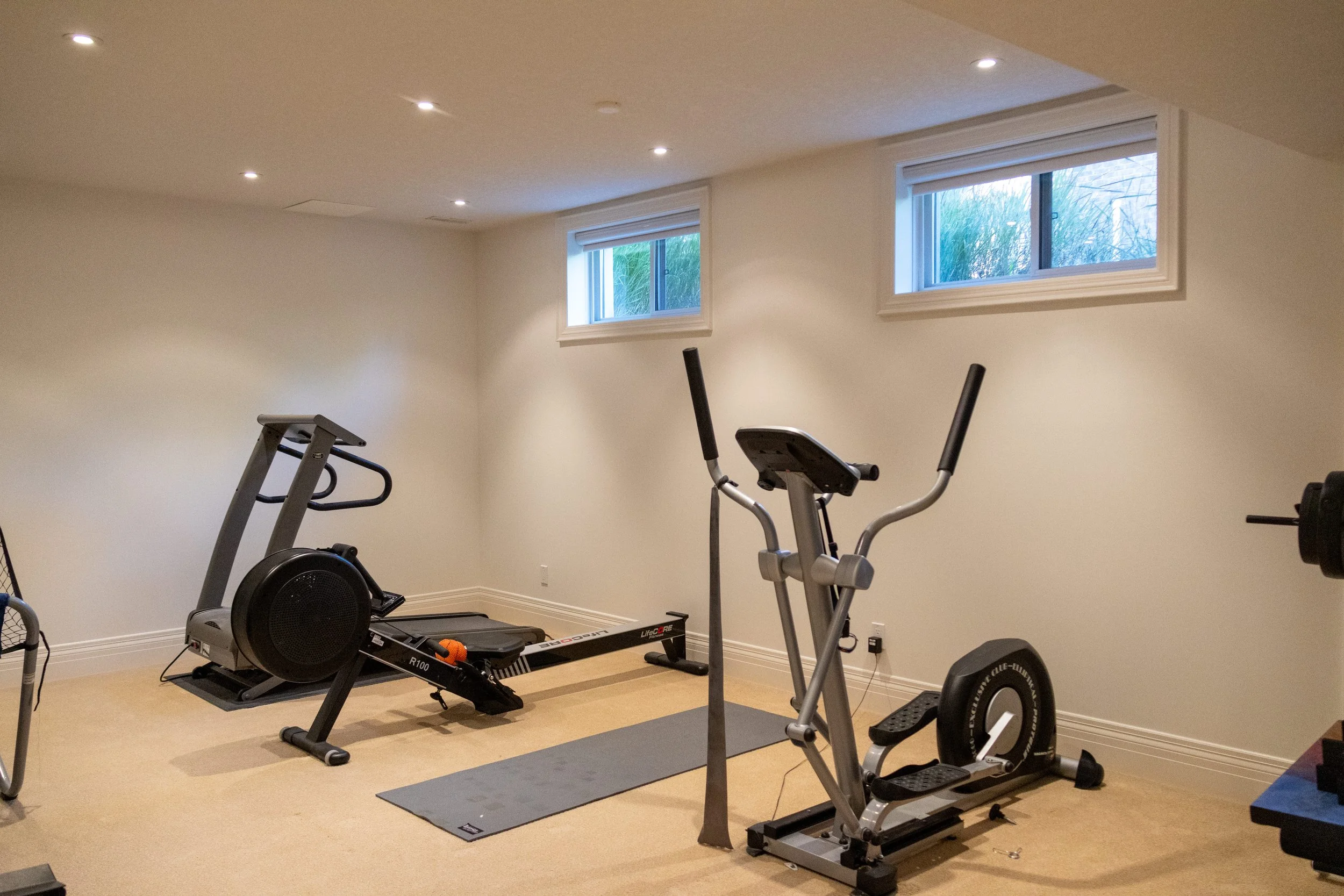 McHugh Painting company in Kitchener, Waterloo, Cambridge region. Off-white walls and paint service. Home gym repaint.