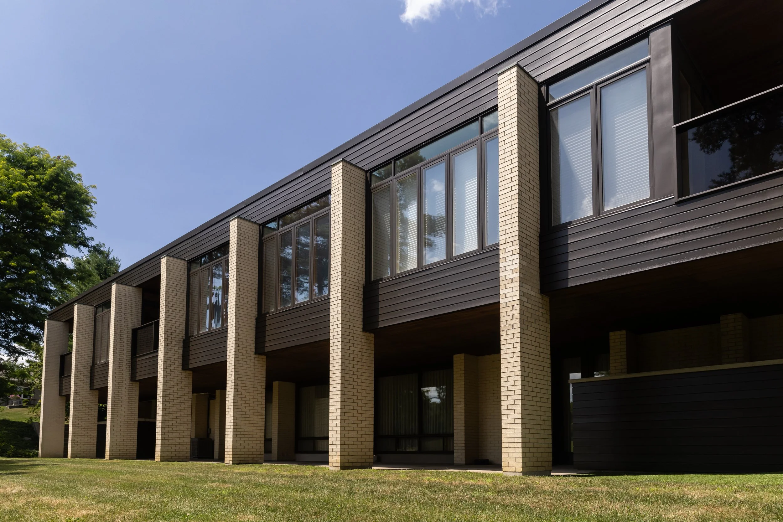 McHugh Painting service. Exterior black walls, window trims and bricks painting