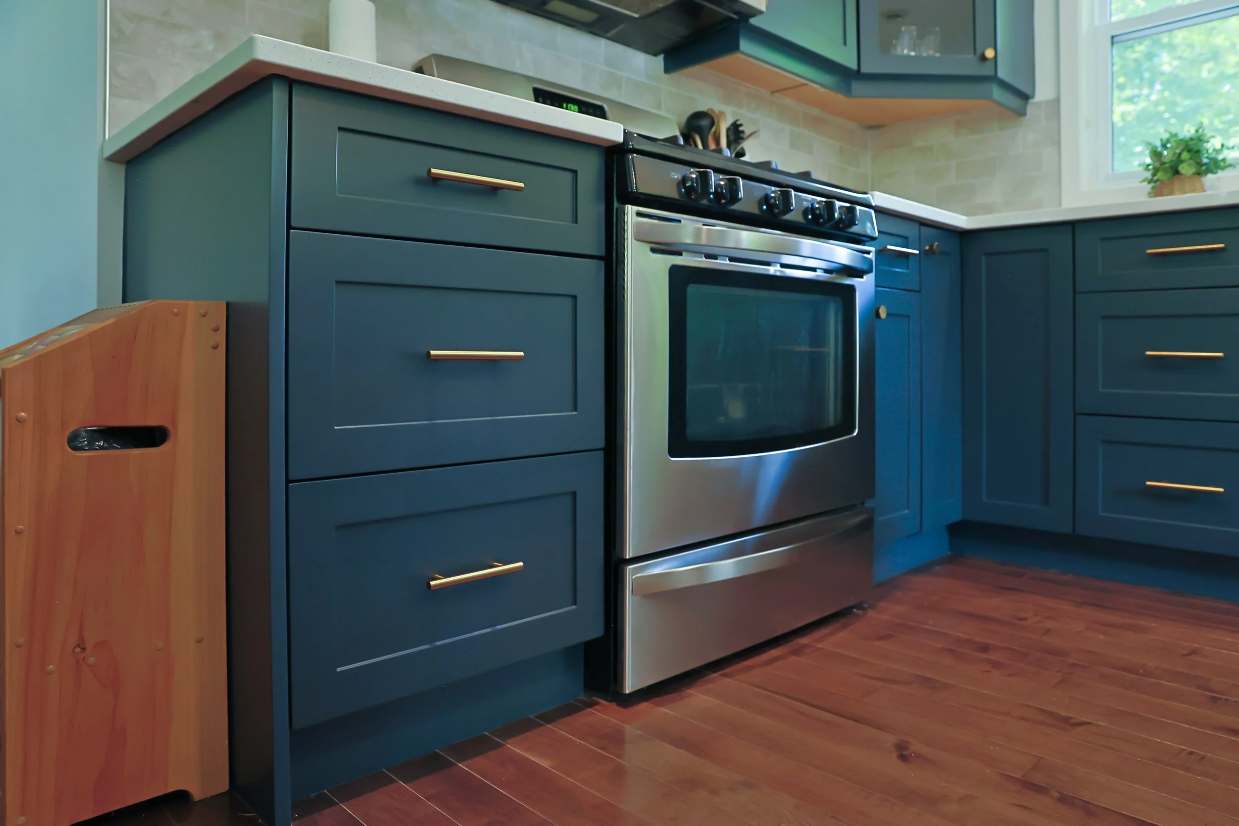 McHugh Painting service. Interior kitchen cabinets. Navy dusty blue kitchen cabinets and trims.