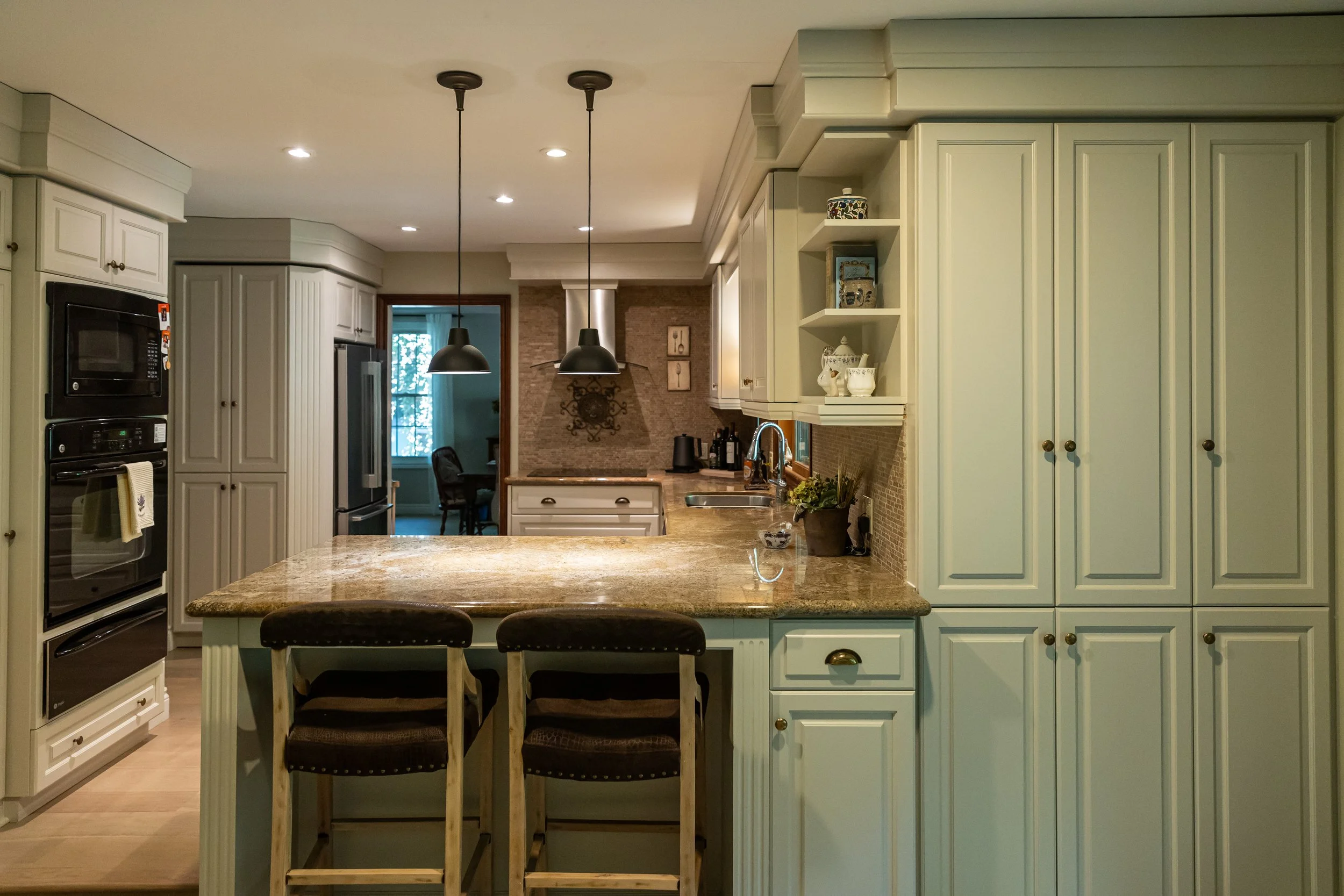 McHugh Painting service. Interior sage green kitchen cabinets.