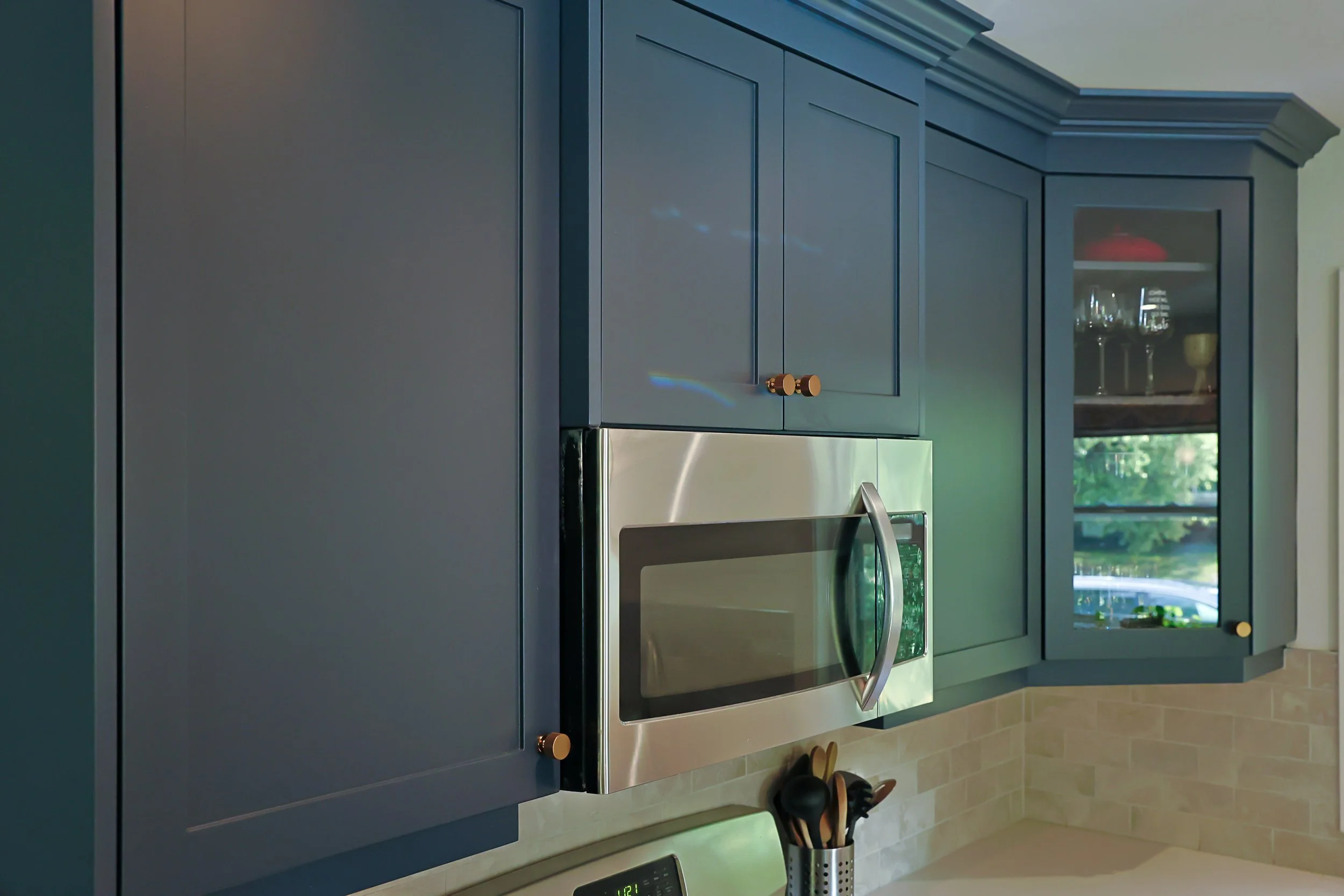 McHugh Painting service. Interior kitchen cabinets. Navy dusty blue kitchen cabinets and trims.