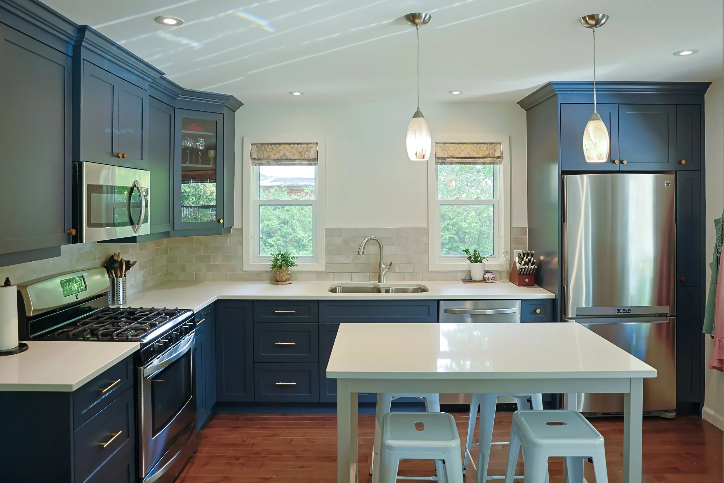 McHugh Painting service. Interior kitchen cabinets. Navy dusty blue kitchen cabinets and trims.