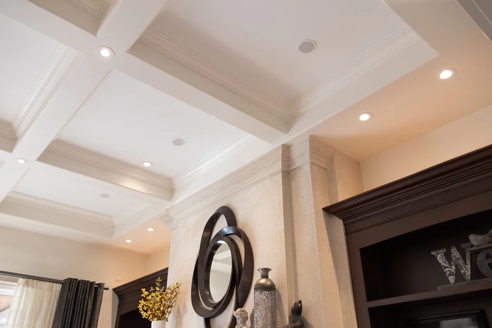 White coffered ceiling, neutral walls and dark built-in trim from McHugh Painting’s interior gallery.