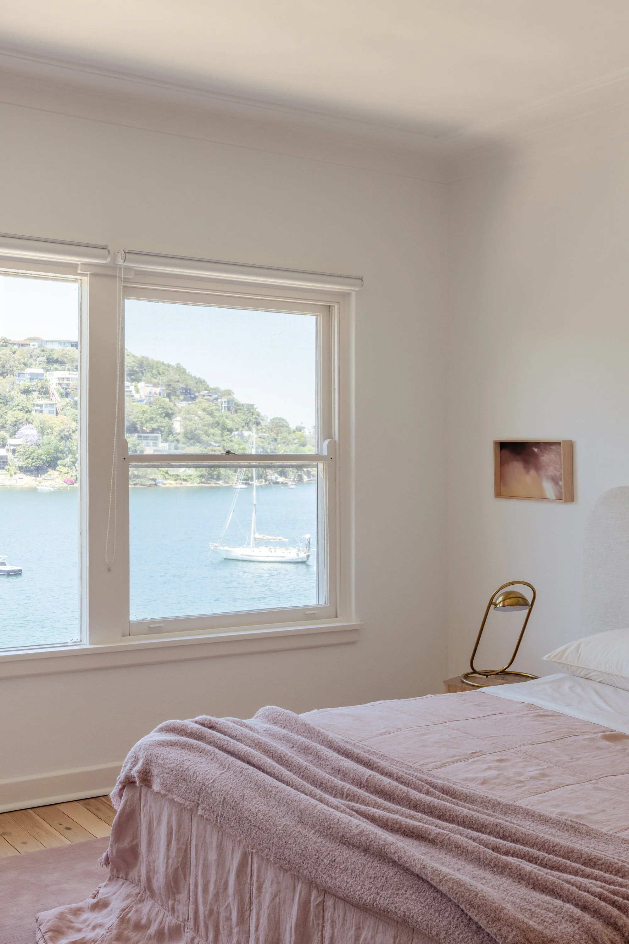 Lightfilled bedroom with water views