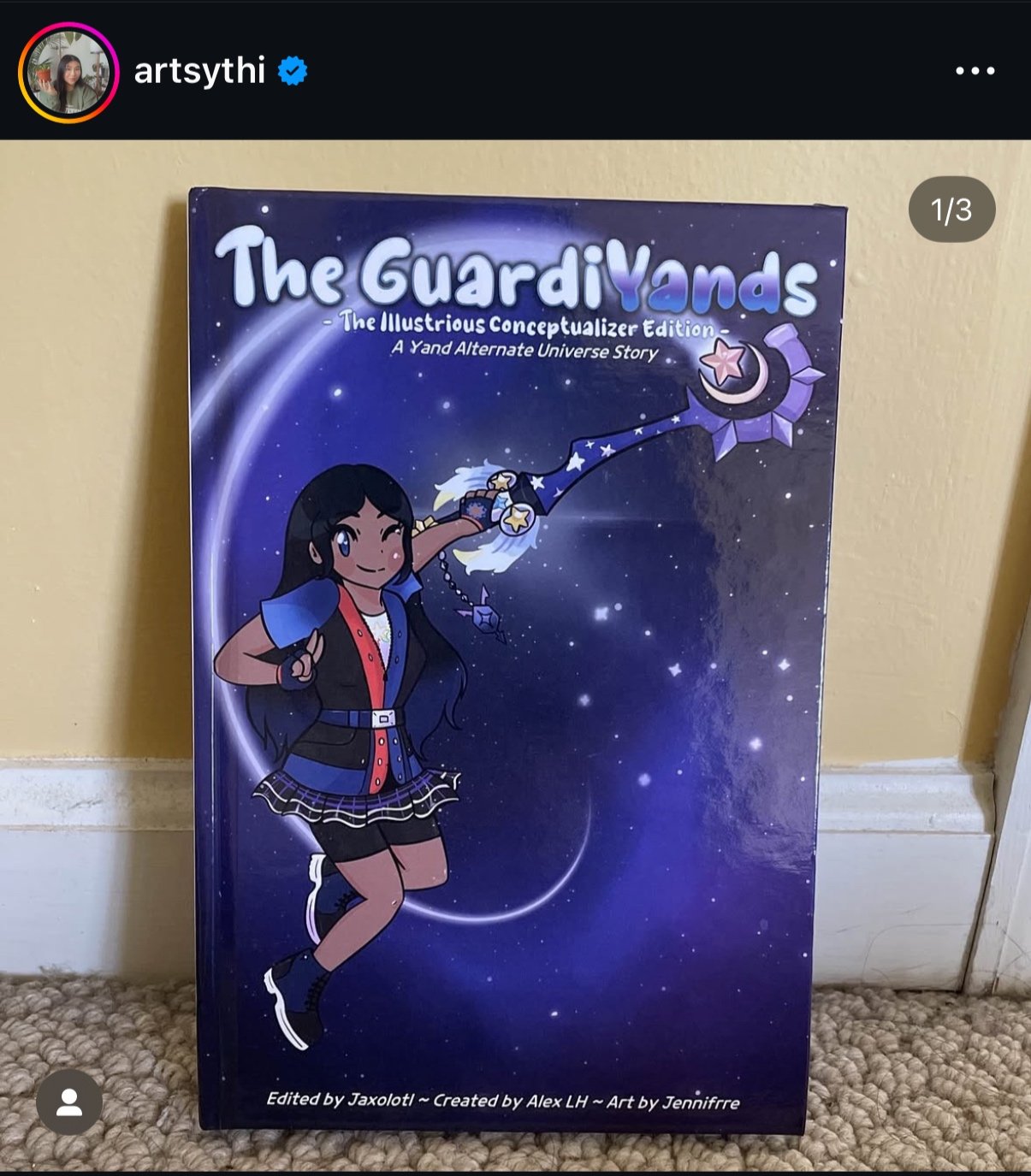 A colorful book cover titled 'The GuardiYands: The Illustrious Conceptualizer Edition'. The cover features a girl with long black hair, wearing a blue and black school uniform, winking and pointing with one hand while casting a spell with the other.