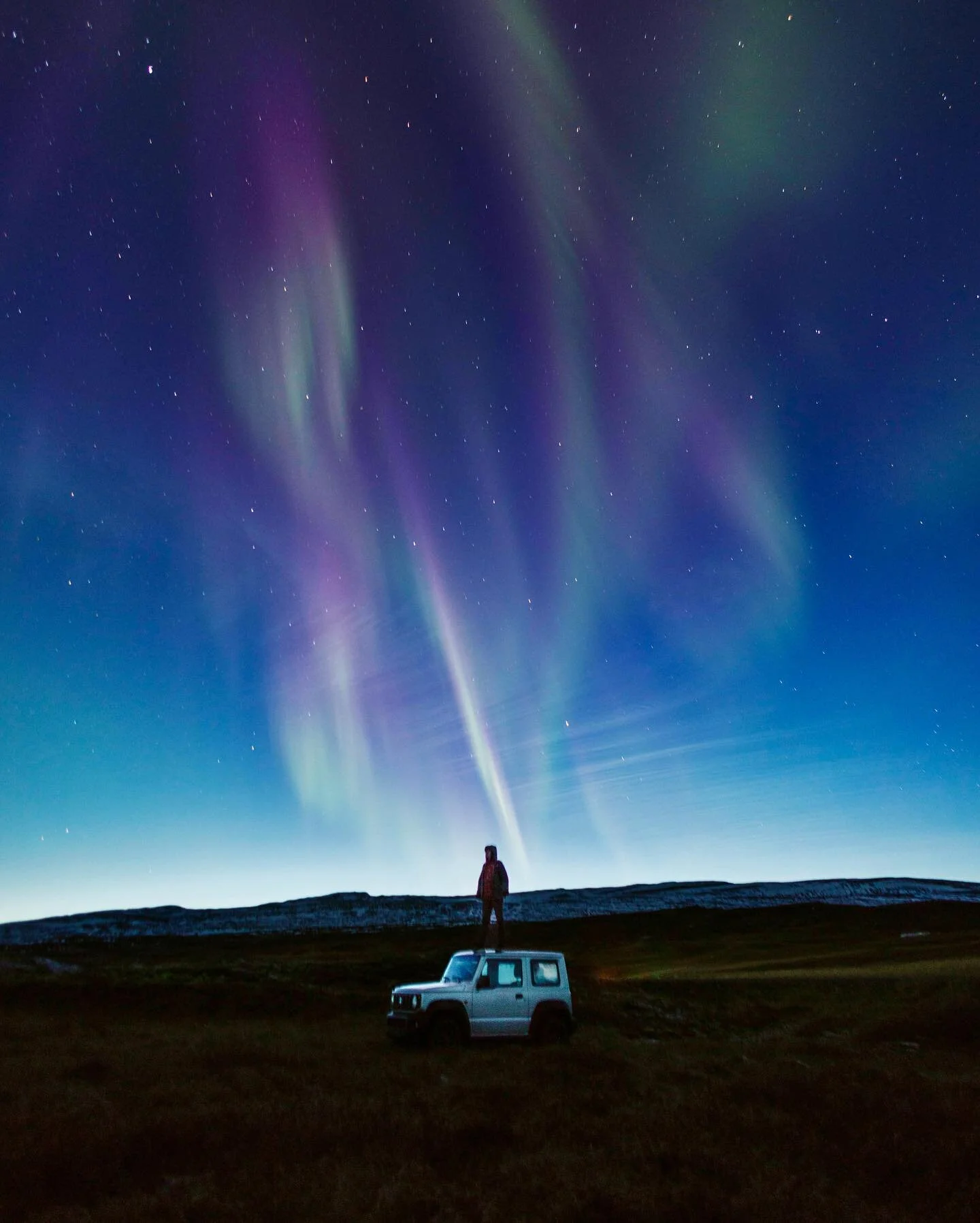 One of my favorites nights of my life. Deep in northern Iceland, @mitevisuals, @sennivisuals, and I were gifted with a stunning aurora borealis at blue-hour, full with greens and the rare purple. There&rsquo;s something so special about a chilly nigh