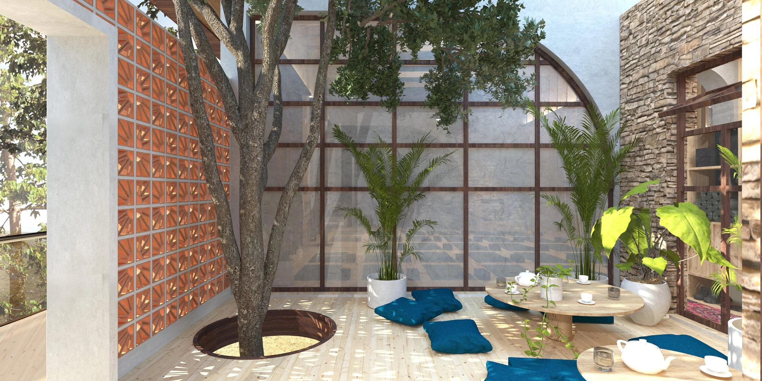 Indoor courtyard with a tree growing in a circle cut into the wooden deck, surrounded by potted plants and seating areas with blue cushions, a table set with cups and teapots, and a decorative brick wall with large windows and a lattice wall.