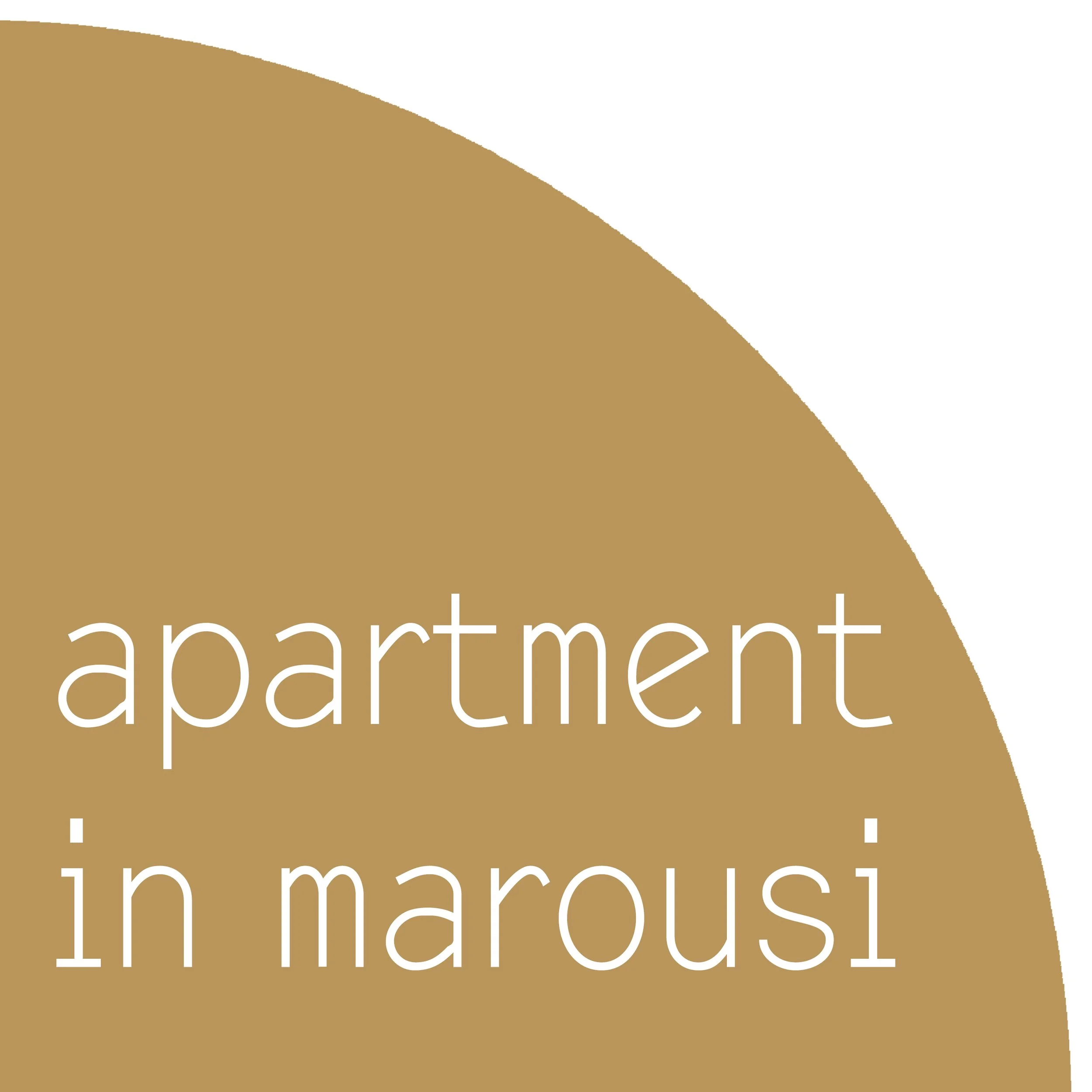 Partial view of a tan colored sign with white text reading 'apartment'.