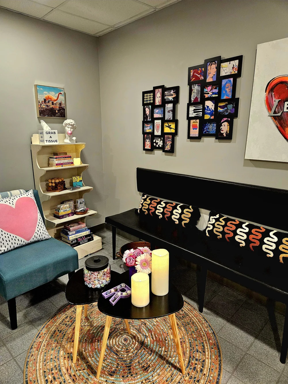 A welcoming lounge with colorful seating and artwork at Re:mind Wellness.