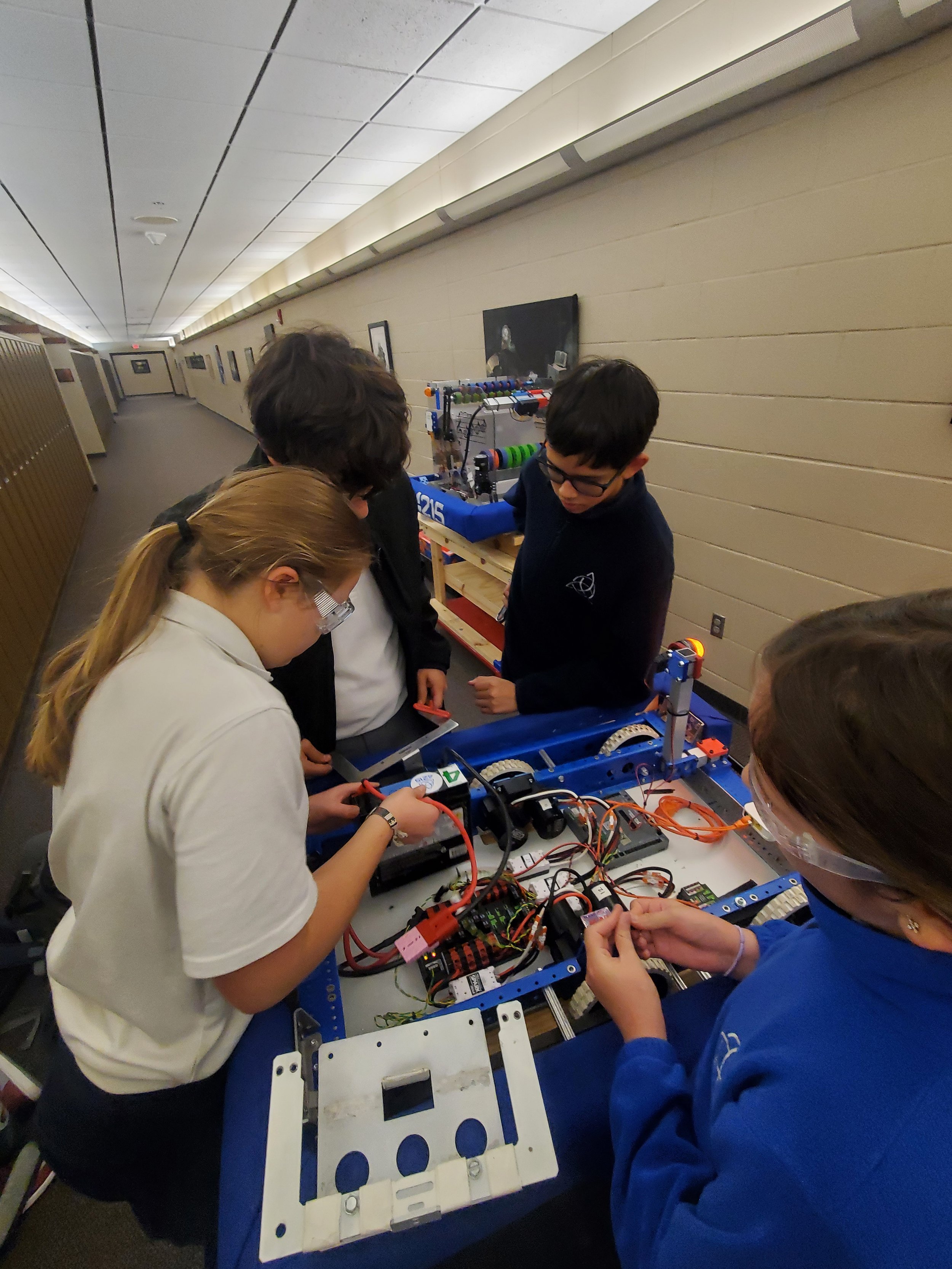 Carefully extracting parts from prior robots.