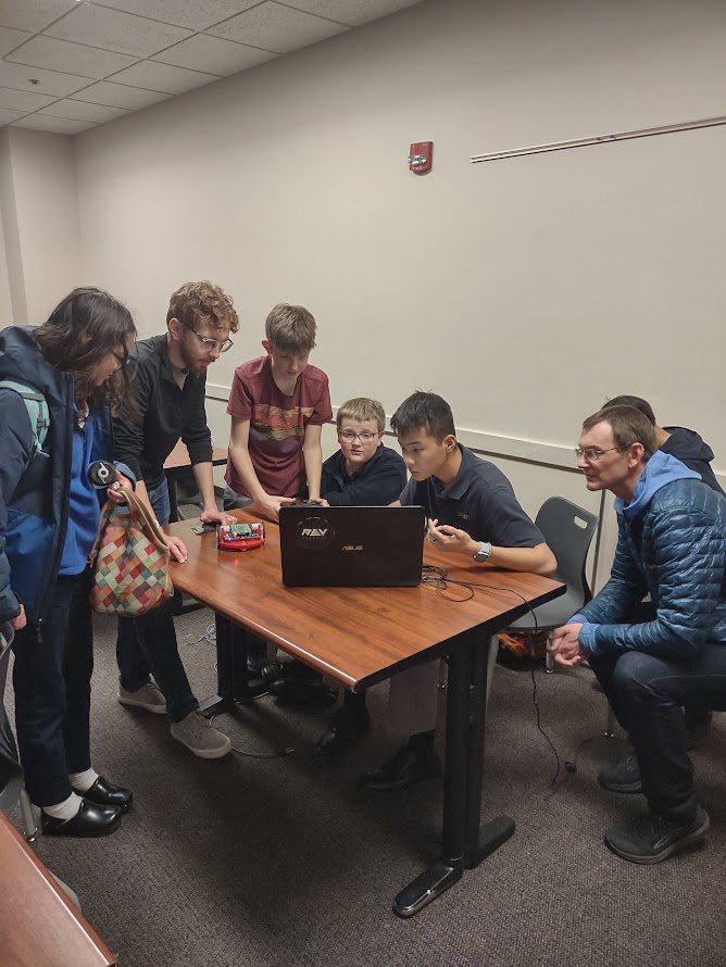 Programming team working hard with our technical mentors.